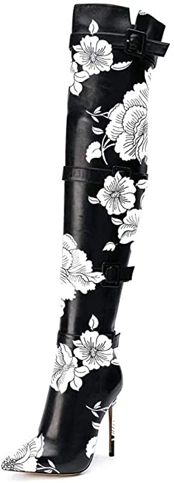 A pair of stylish pointed toe buckled strappy thigh high boots in black, featuring a high heel and elegant design.