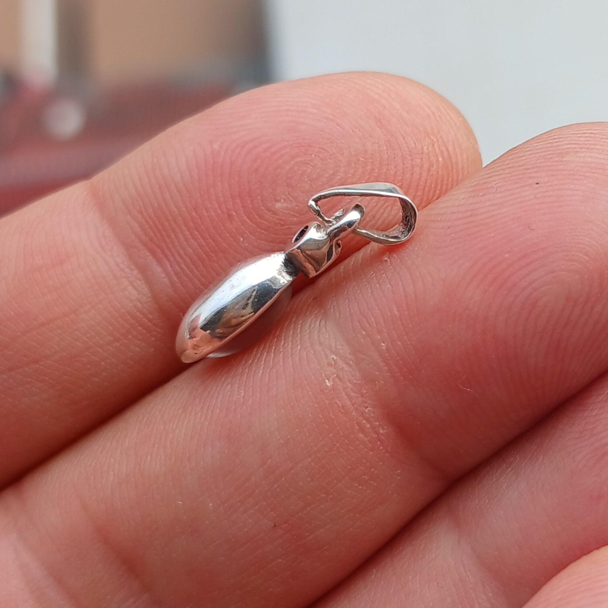 Elegant sterling silver moonstone pendant with cubic zirconia accents, showcasing a beautiful moonstone centerpiece.