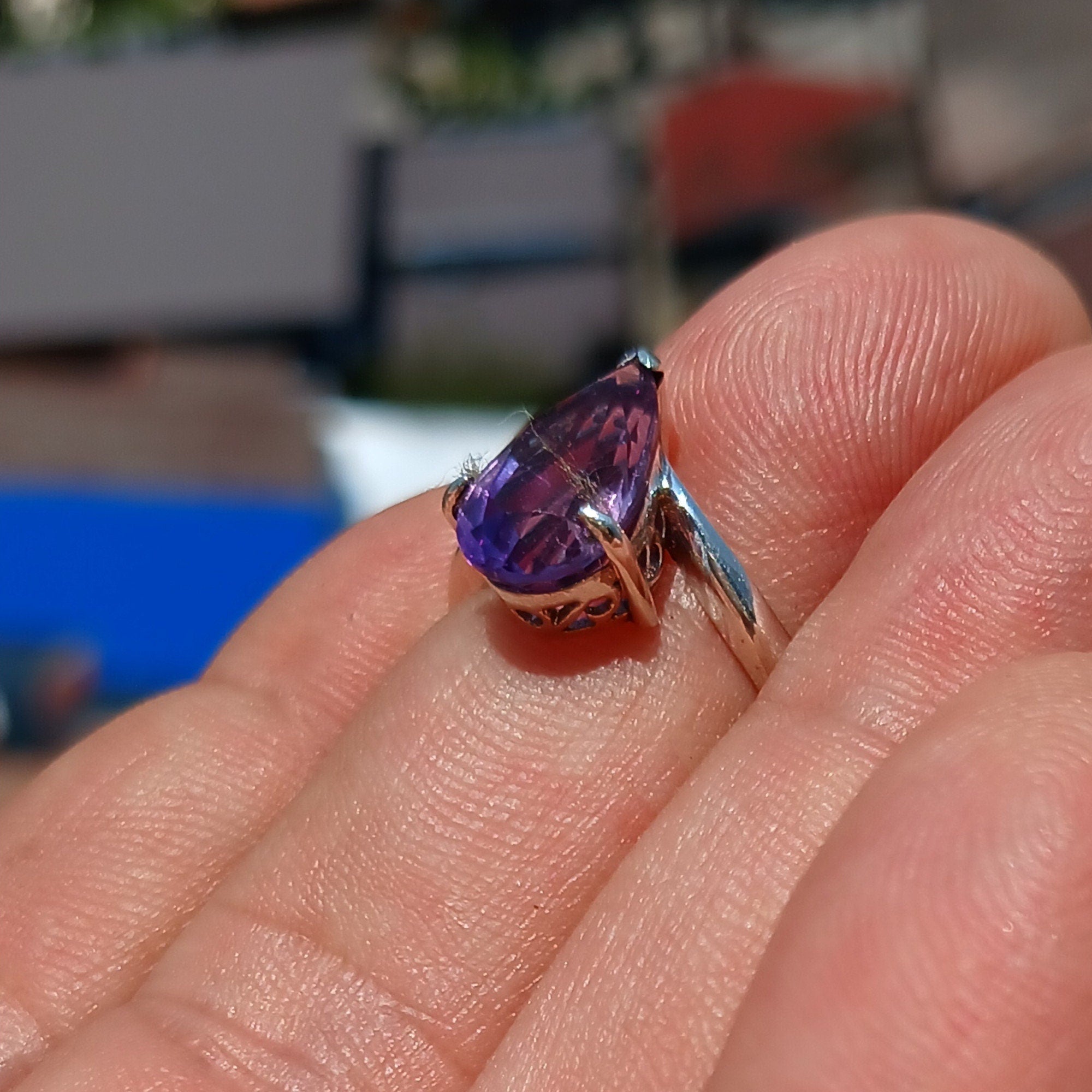 A beautiful purple amethyst ring in sterling silver, featuring a pear-shaped gemstone with a polished finish, showcasing elegance and style.