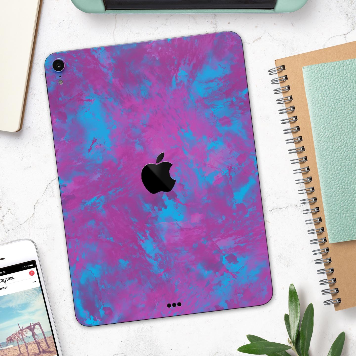 Purple and Blue Paintburst skin decal for Apple iPad, showcasing vibrant colors and sleek design.