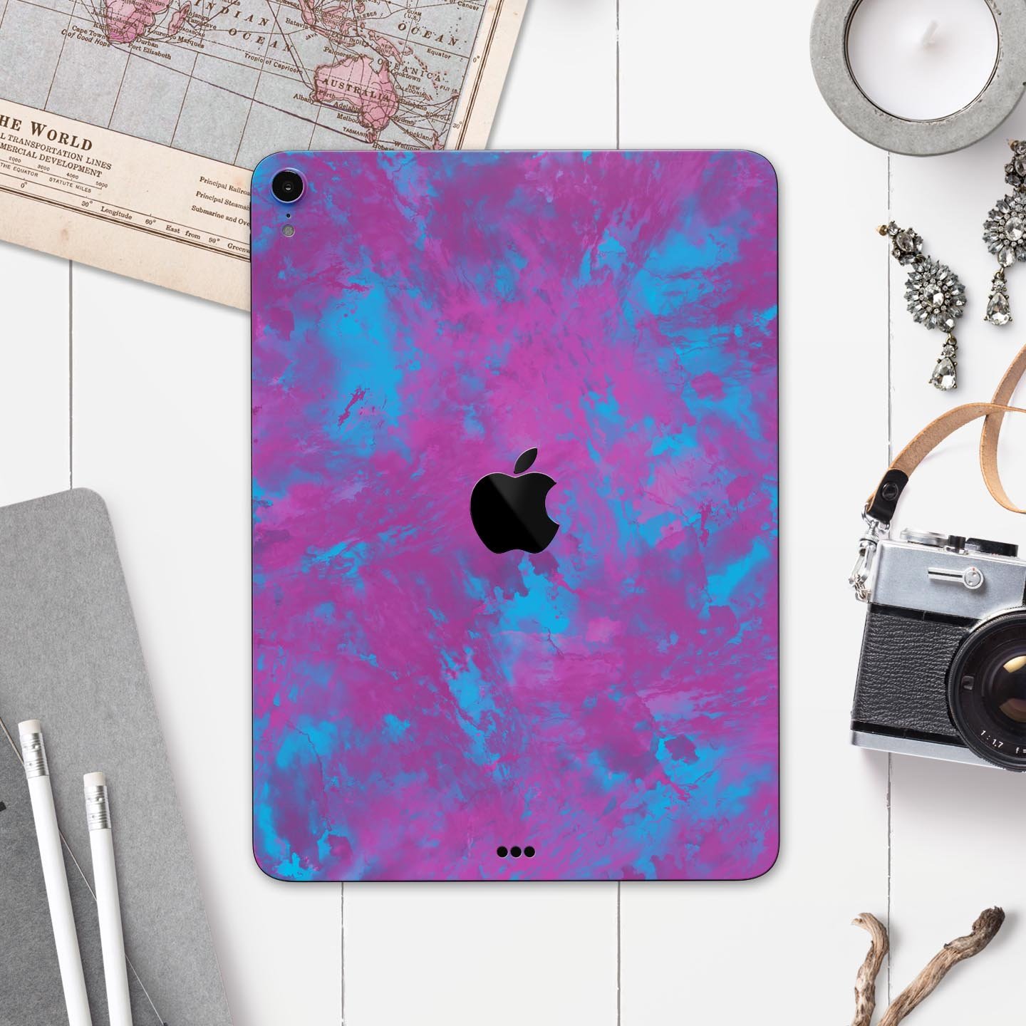Purple and Blue Paintburst skin decal for Apple iPad, showcasing vibrant colors and sleek design.