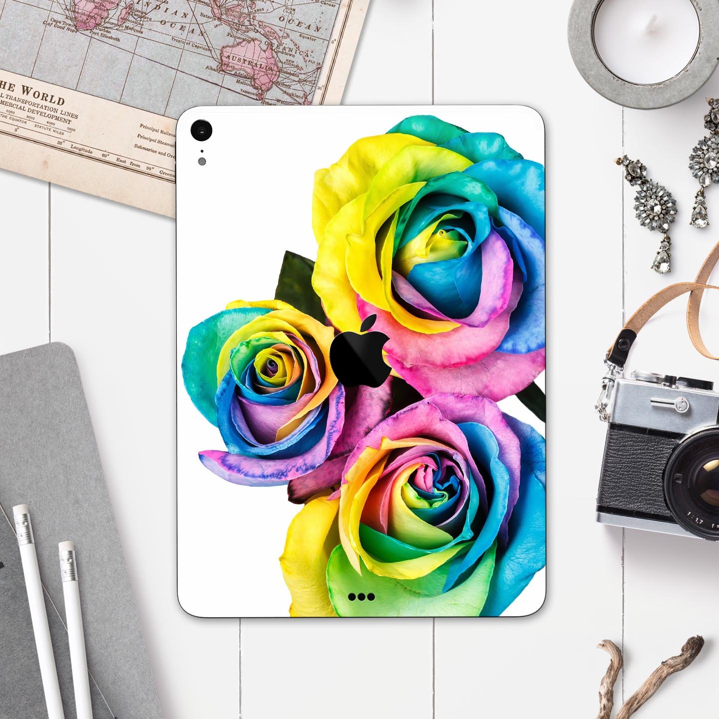 Colorful Rainbow Dyed Roses skin decal for Apple iPad Pro, showcasing vibrant floral design and ultra-thin protection.