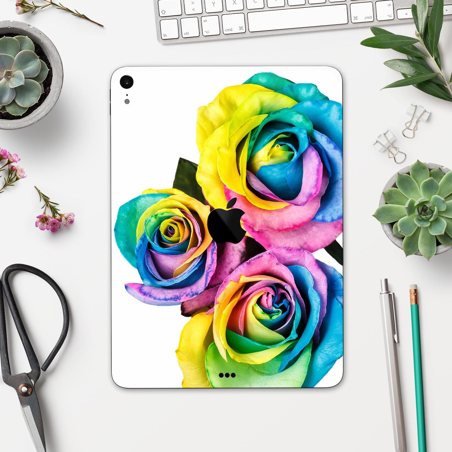Colorful Rainbow Dyed Roses skin decal for Apple iPad Pro, showcasing vibrant floral design and ultra-thin protection.
