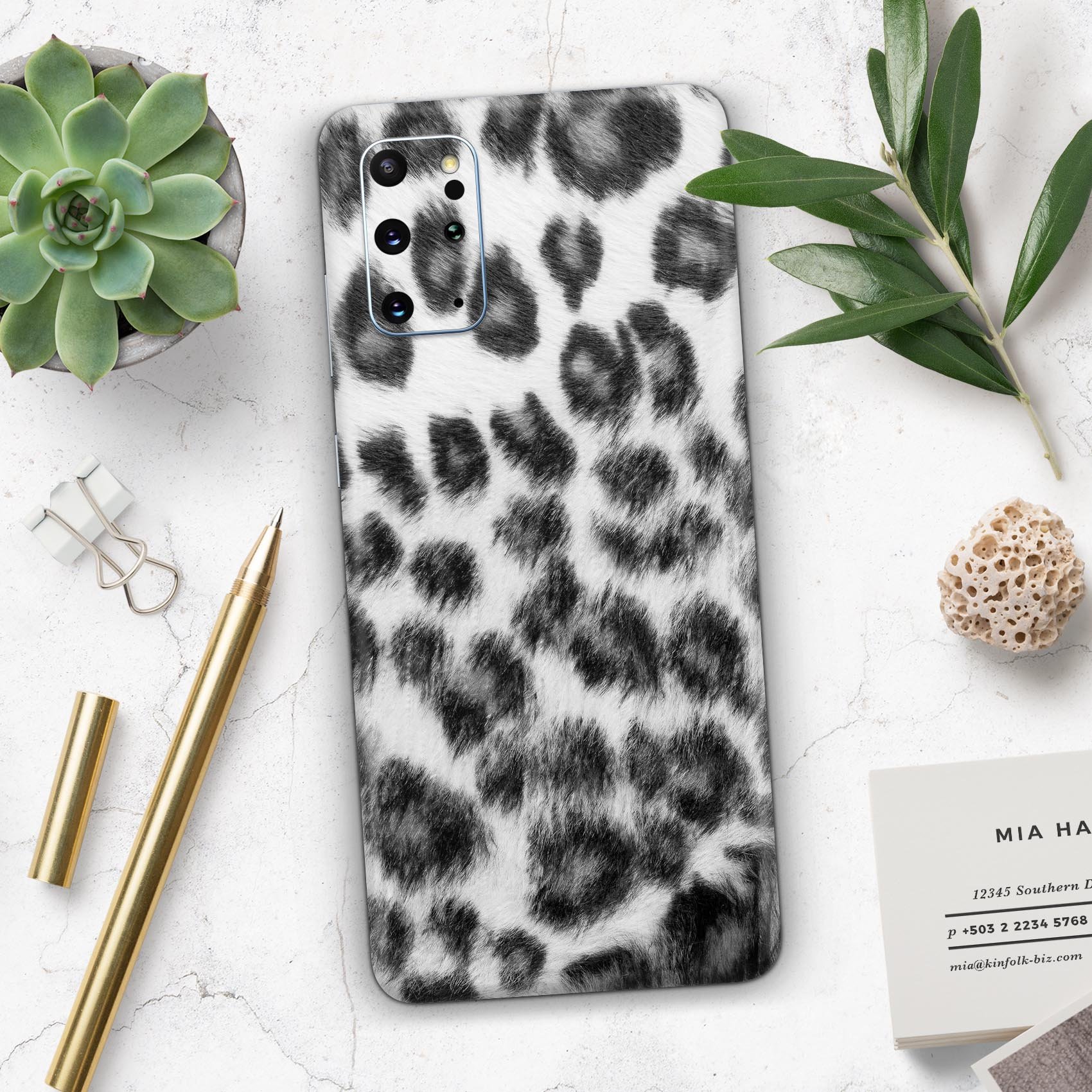 Real Snow Leopard Hide skin for Samsung Galaxy S20, showcasing its unique design and texture.
