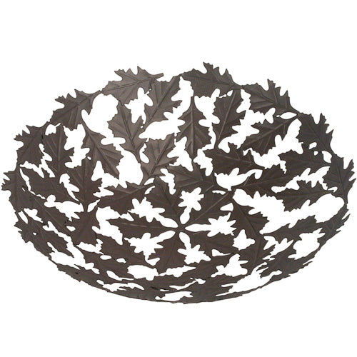 A beautifully crafted Recycled Metal Oak Leaf Bowl made from salvaged bicycle spokes, showcasing intricate leaf designs.