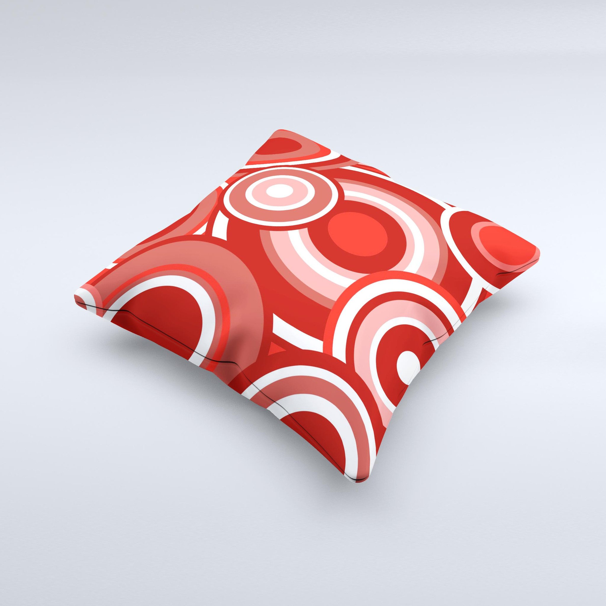 A vibrant red and white decorative throw pillow featuring layered vector circles, handcrafted in Virginia with a high thread count fabric.