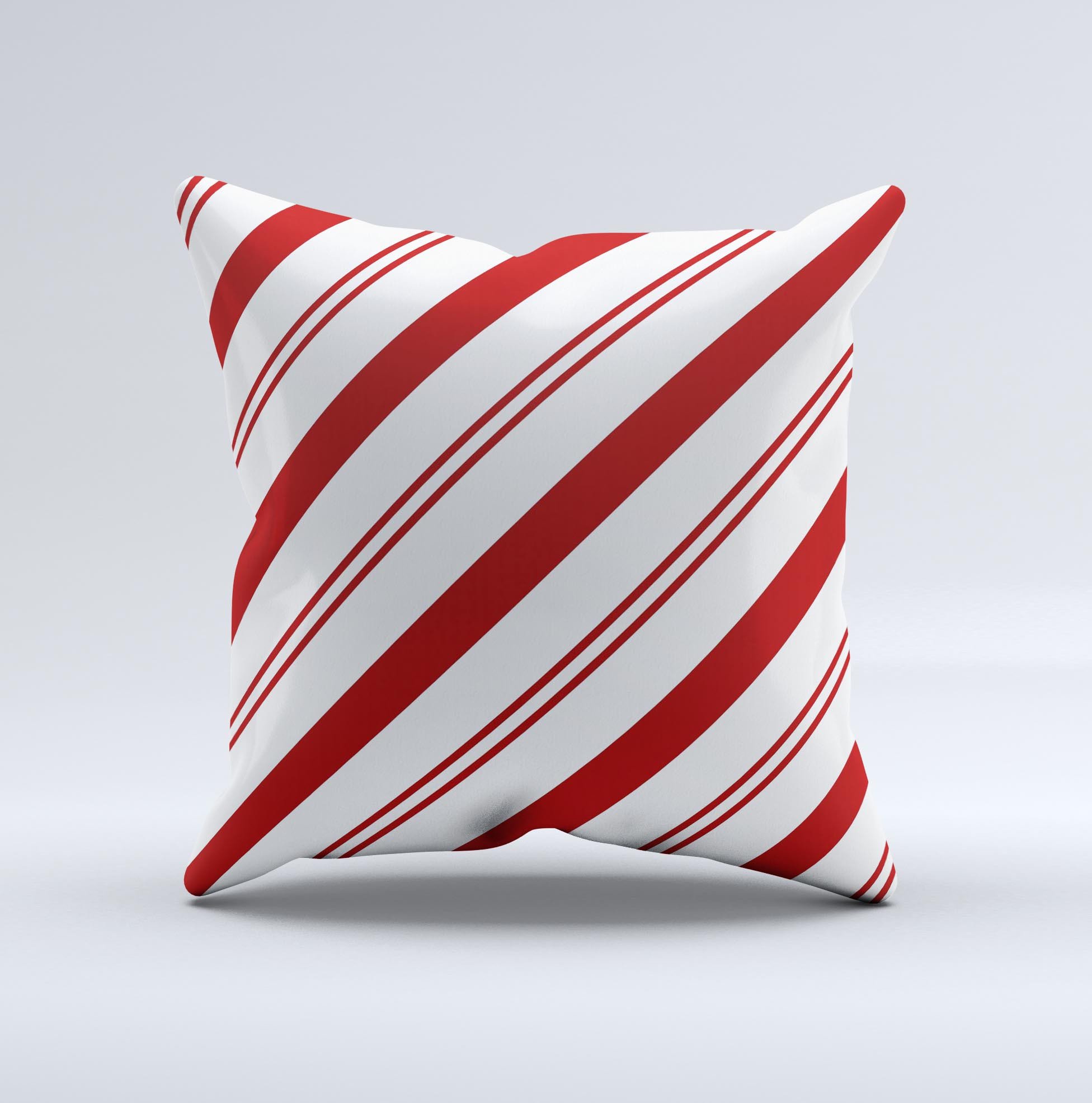 Red and white decorative throw pillow with slanted vector stripes, showcasing a unique handmade design.