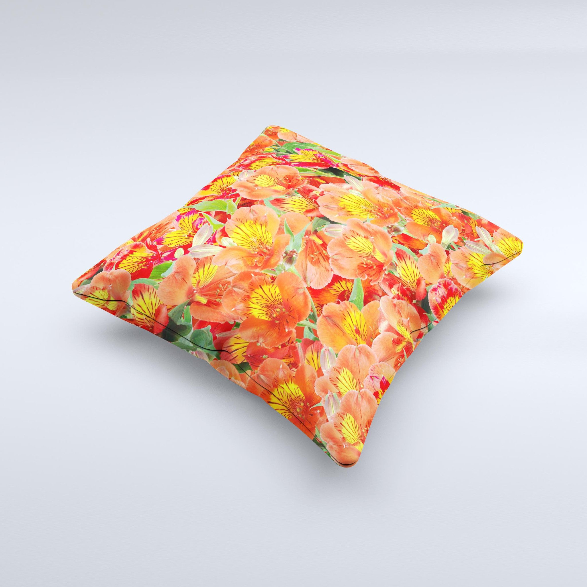 A vibrant decorative throw pillow featuring red and yellow watercolor flowers on a soft fabric, handcrafted in Virginia.