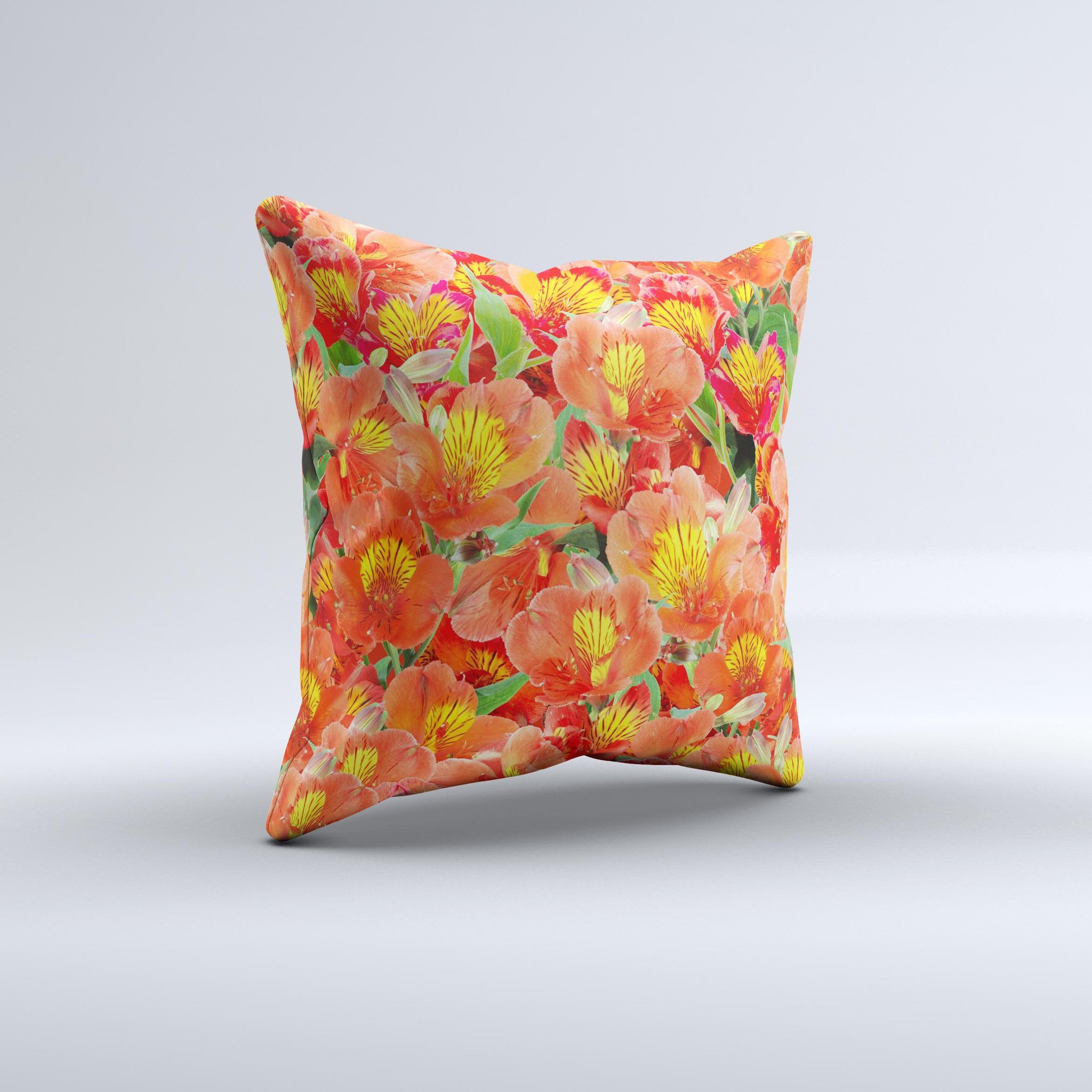 A vibrant decorative throw pillow featuring red and yellow watercolor flowers on a soft fabric, handcrafted in Virginia.