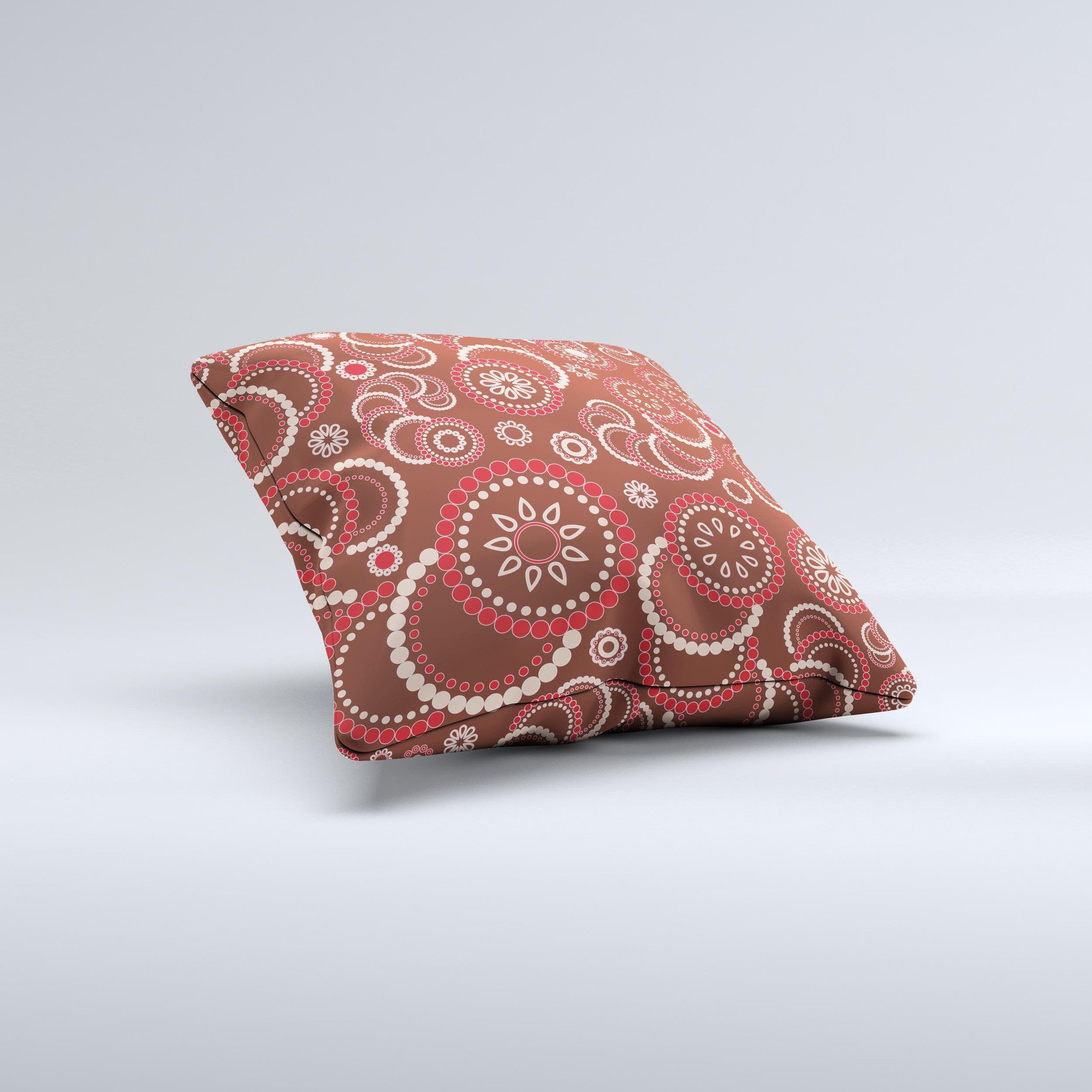 A beautifully handcrafted throw pillow featuring a vibrant red and brown flower pattern, showcasing unique imperfections from the printing process.