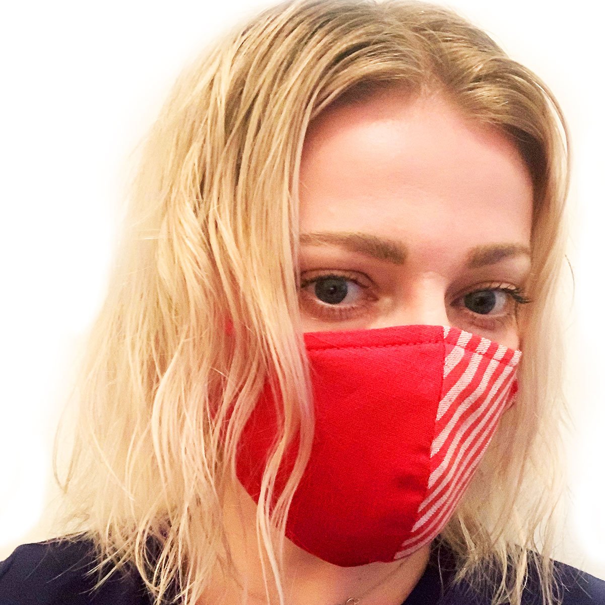 Handmade red face mask made from 100% organic linen with a pocket filter, adjustable elastic loops, and moldable nose bridge.