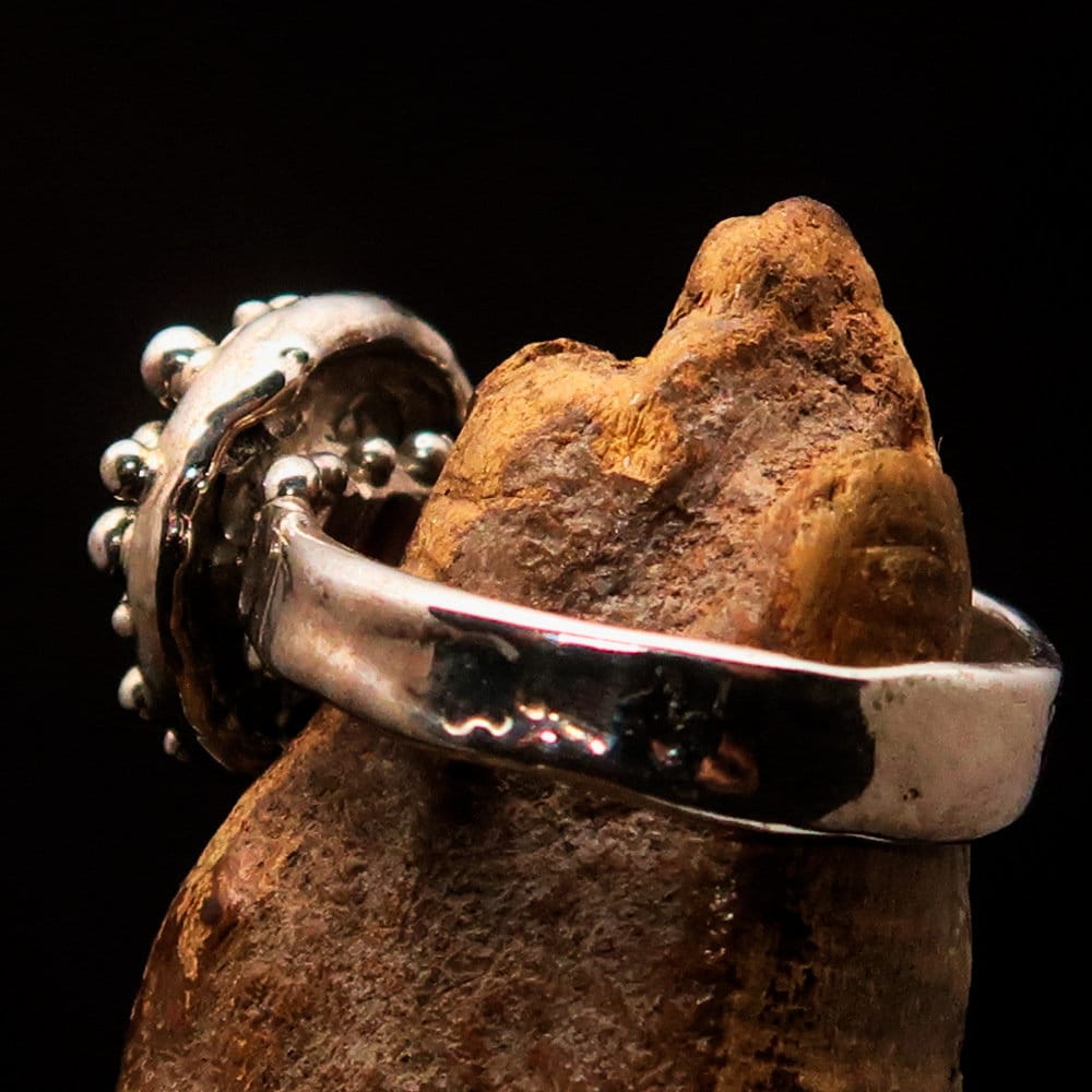 A beautifully crafted red garnet ring set in polished sterling silver, featuring an oval cut garnet and hallmarked 925 for authenticity.