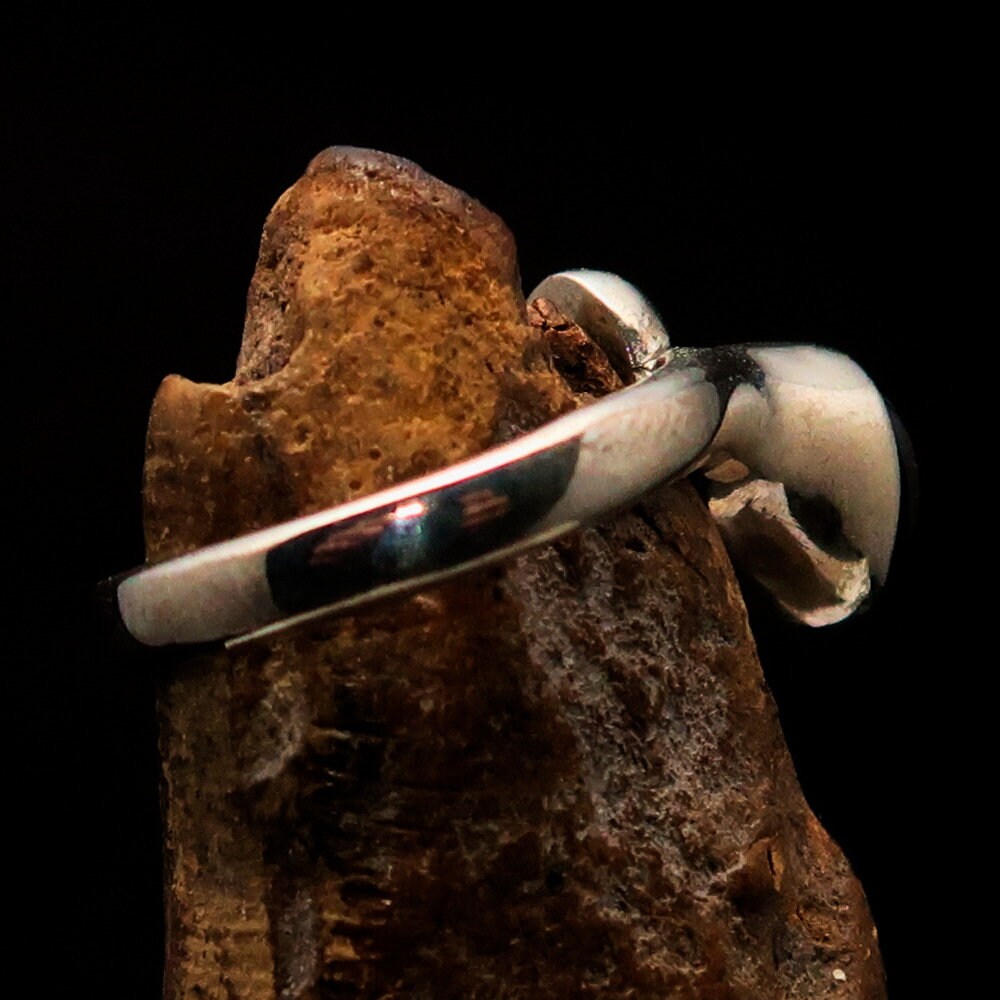 Handmade Red Garnet Ring in sterling silver with an oval-shaped garnet cabochon, showcasing a polished finish.