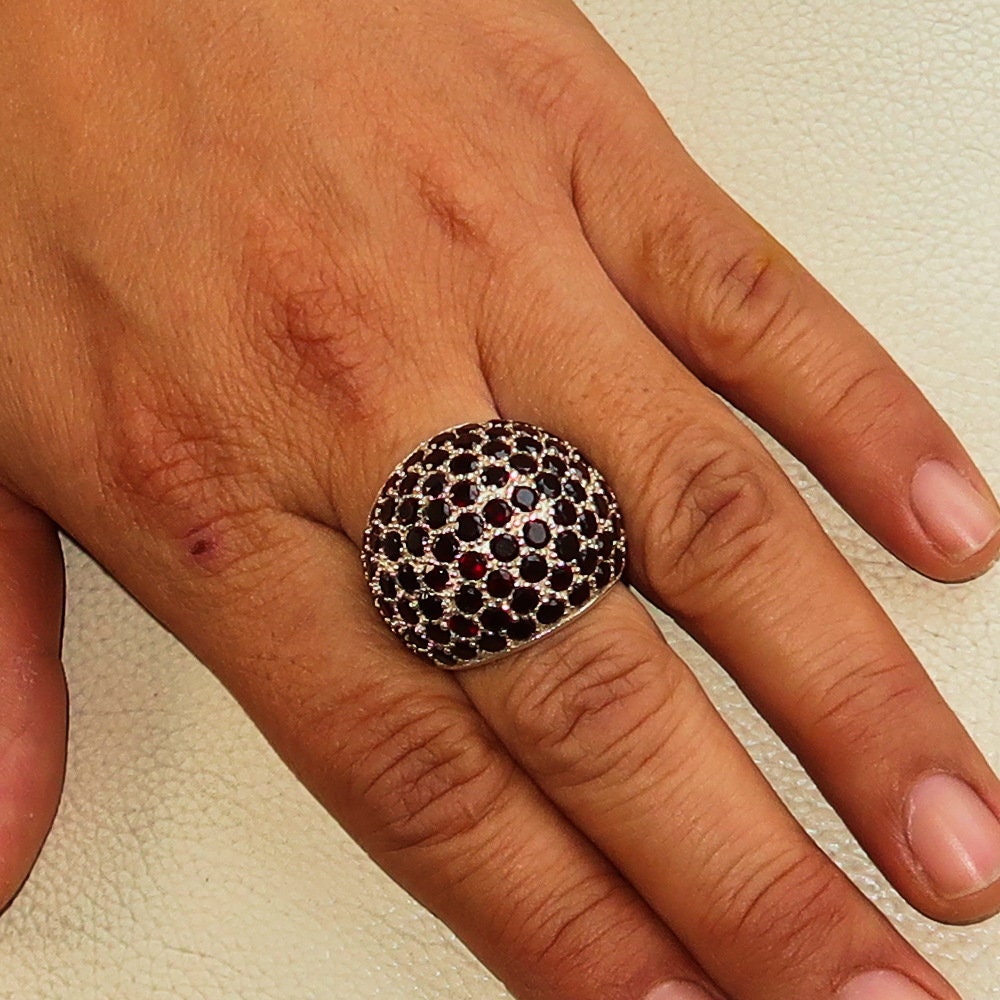 Handmade sterling silver ring featuring 86 round 3mm red garnets in a stunning sphere design.