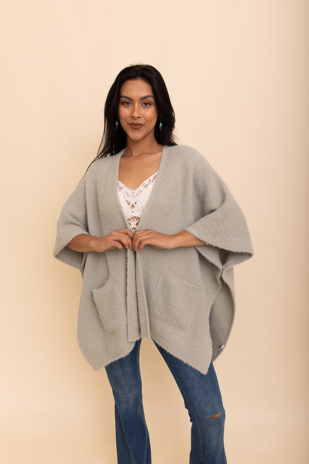 A cozy Relax & Chill Autumn Nights Boucle Cardigan in soft fabric, featuring two pockets and a stylish design, perfect for autumn wear.