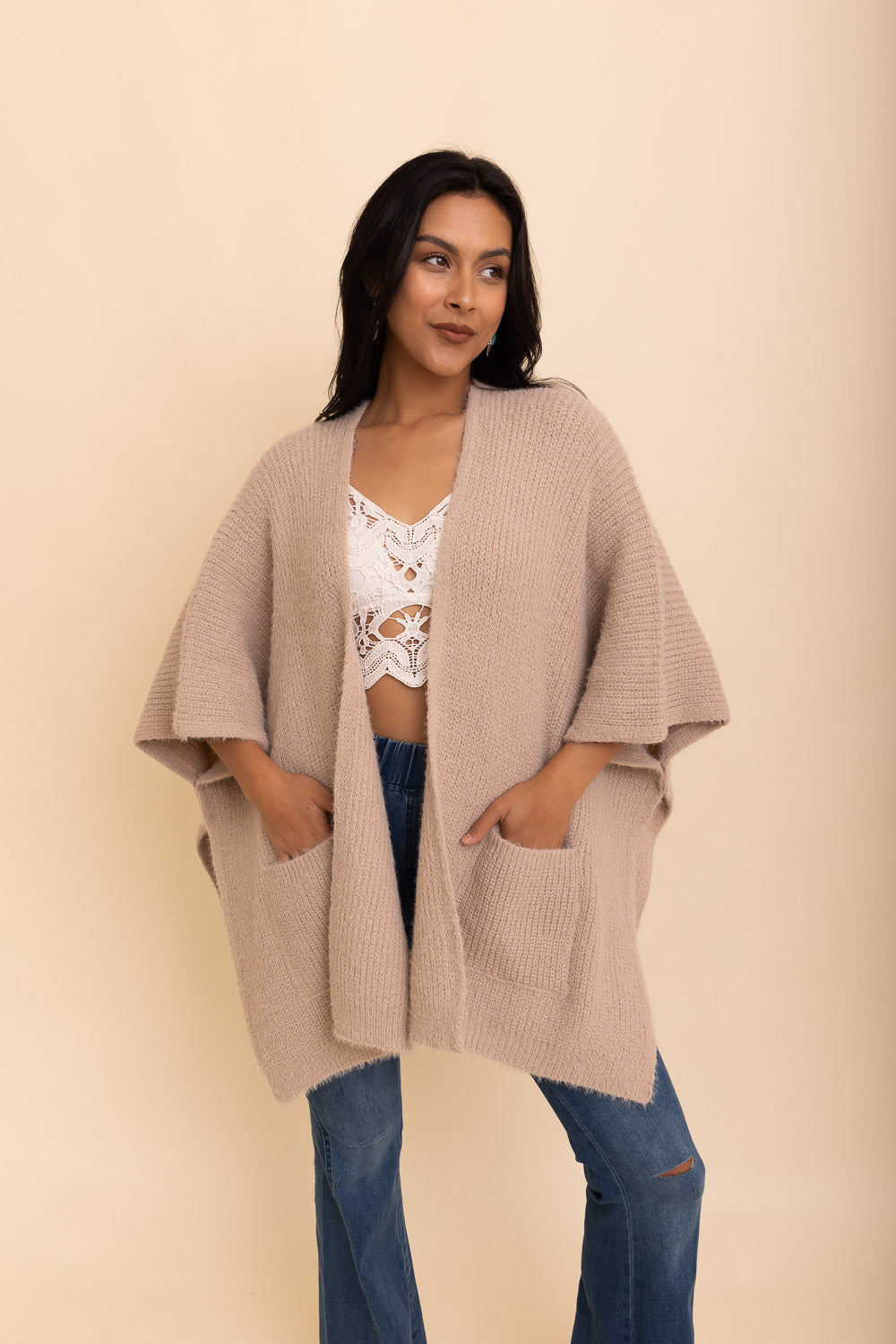 A cozy Relax & Chill Autumn Nights Boucle Cardigan in soft fabric, featuring two pockets and a stylish design, perfect for autumn wear.