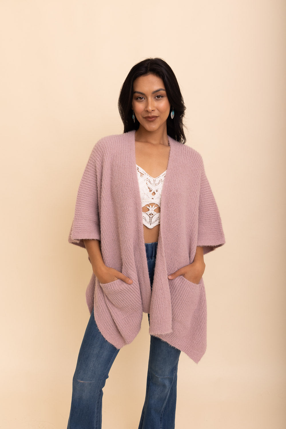 A cozy Relax & Chill Autumn Nights Boucle Cardigan in soft fabric, featuring two pockets and a stylish design, perfect for autumn wear.