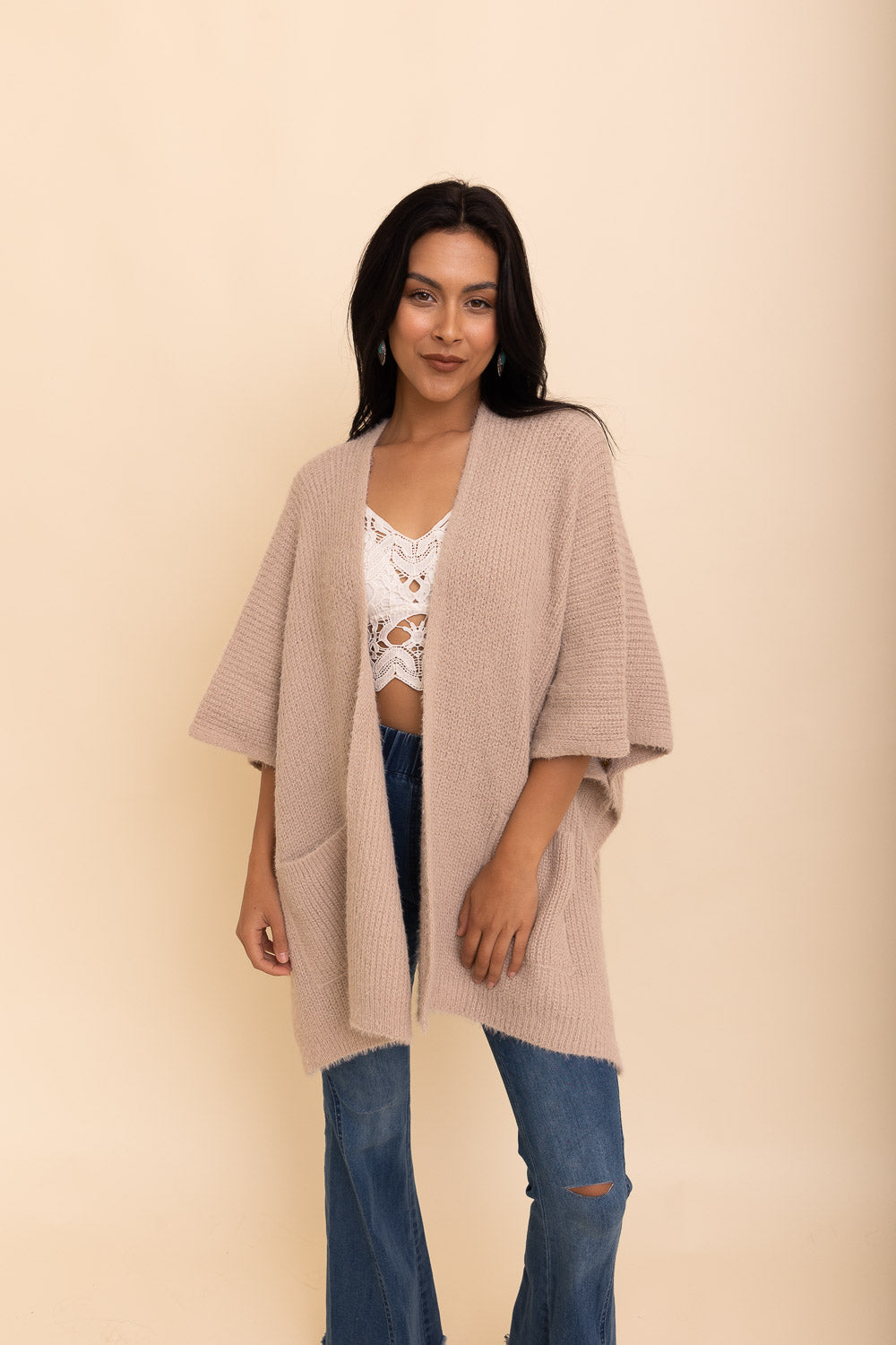 A cozy Relax & Chill Autumn Nights Boucle Cardigan in soft fabric, featuring two pockets and a stylish design, perfect for autumn wear.