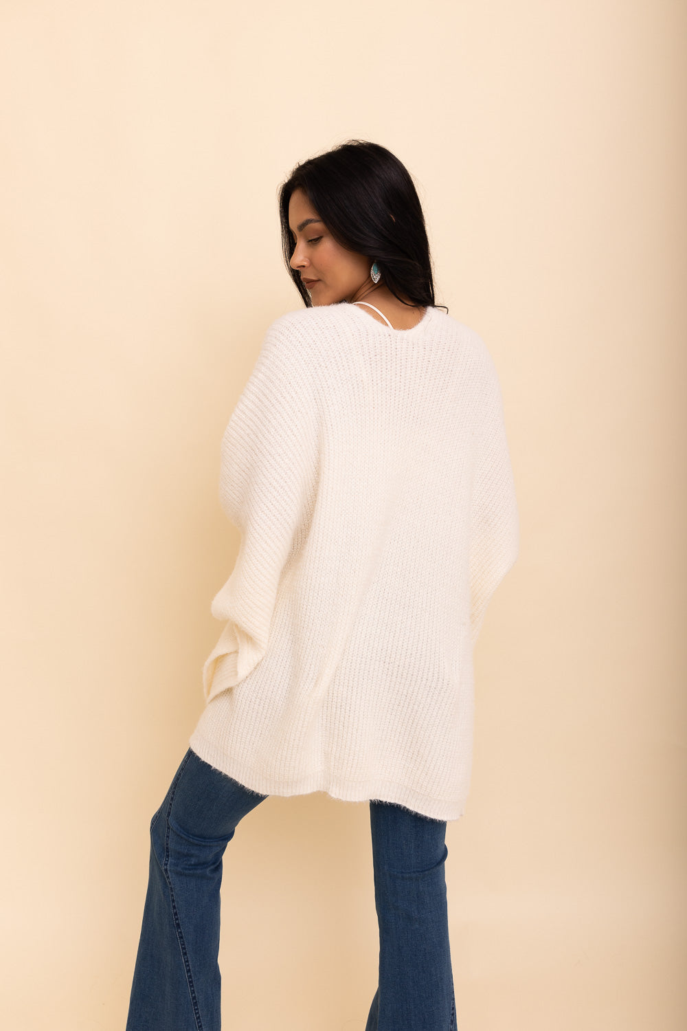 A cozy Relax & Chill Autumn Nights Boucle Cardigan in soft fabric, featuring two pockets and a stylish design, perfect for autumn wear.