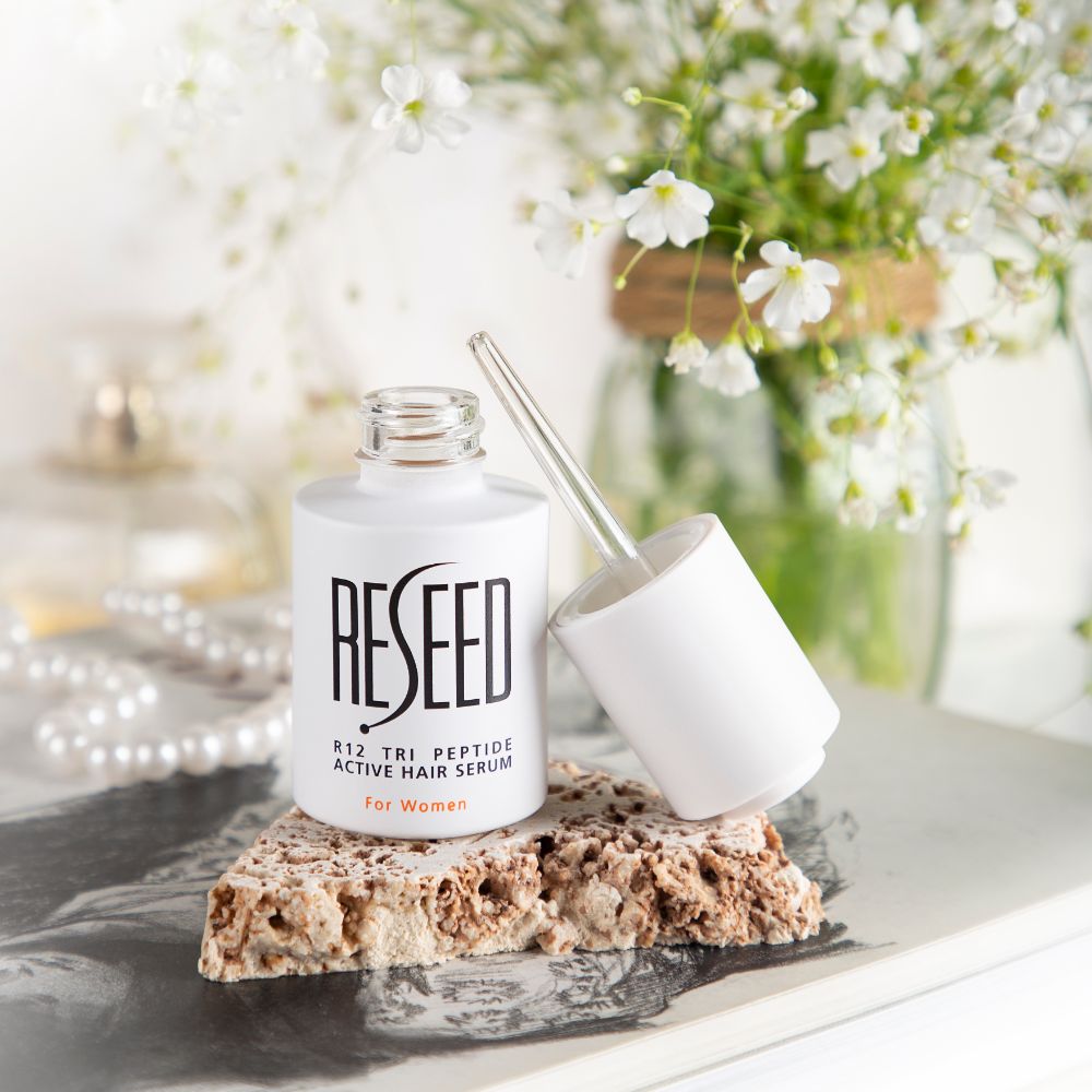 RESEED R12 Tri Peptide Active Hair Serum for Women in a 30ml bottle, showcasing its sleek design and label.