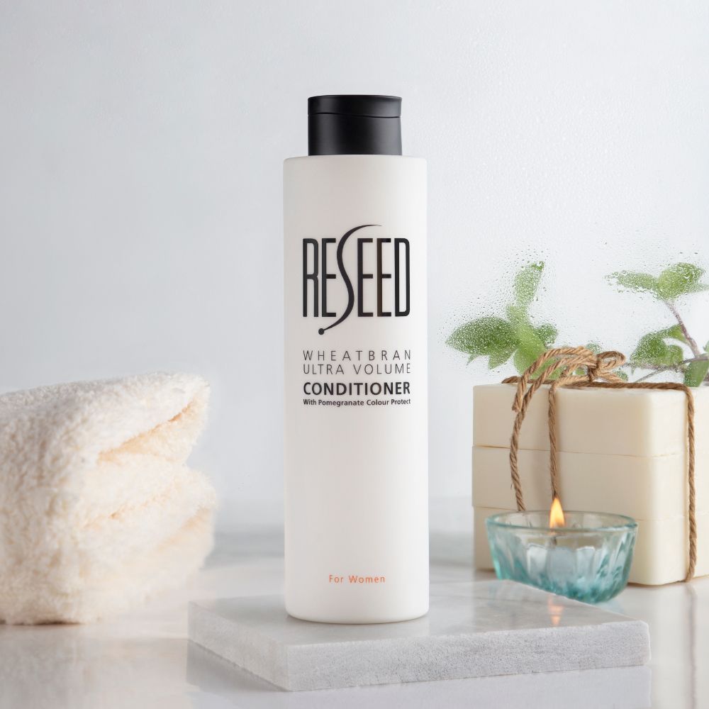 RESEED Wheat Bran Ultra Volume Conditioner for Women in a 250ml bottle, showcasing its sleek design and natural ingredients.