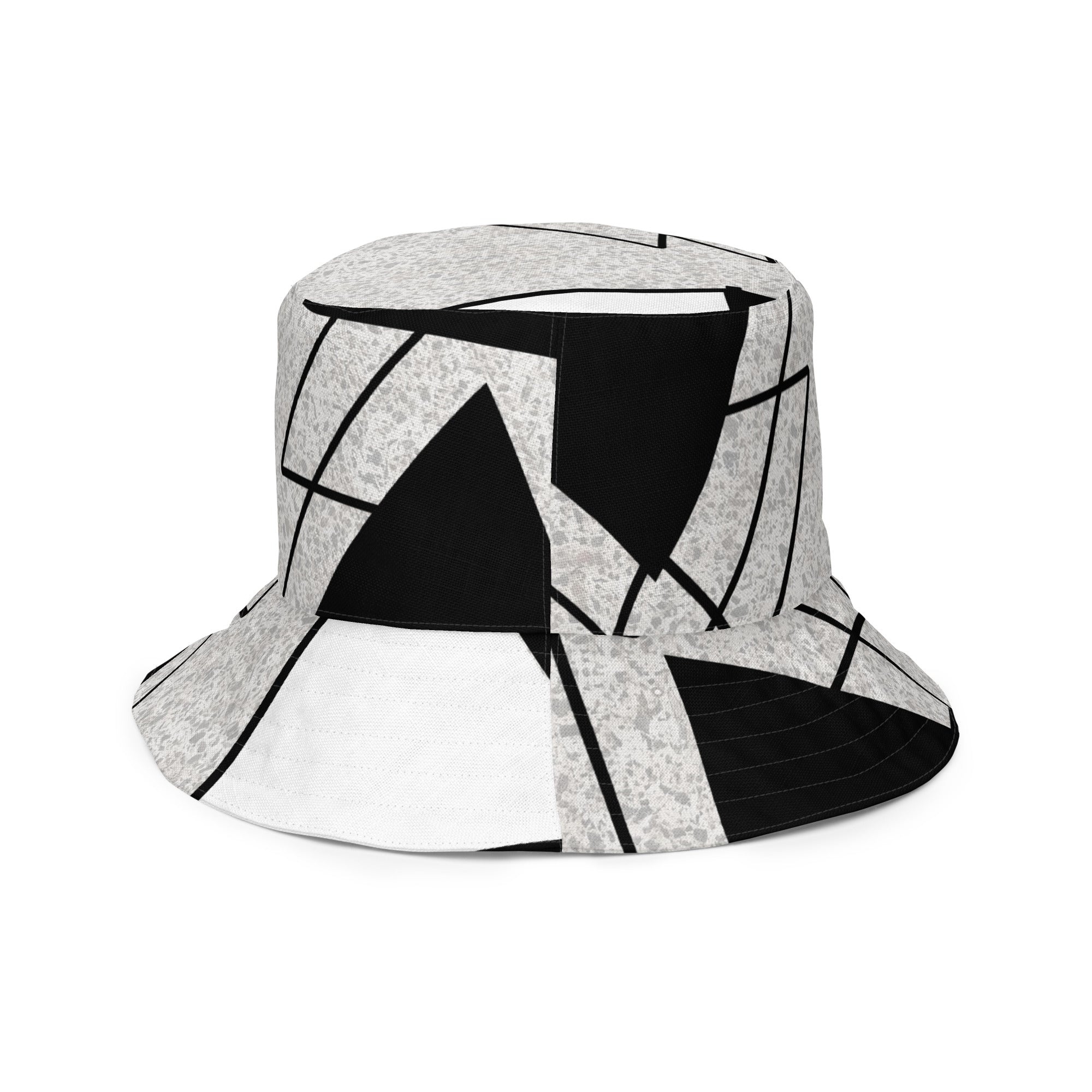 Reversible bucket hat featuring black and white ash grey triangular colorblock design, showcasing its stylish and versatile look.