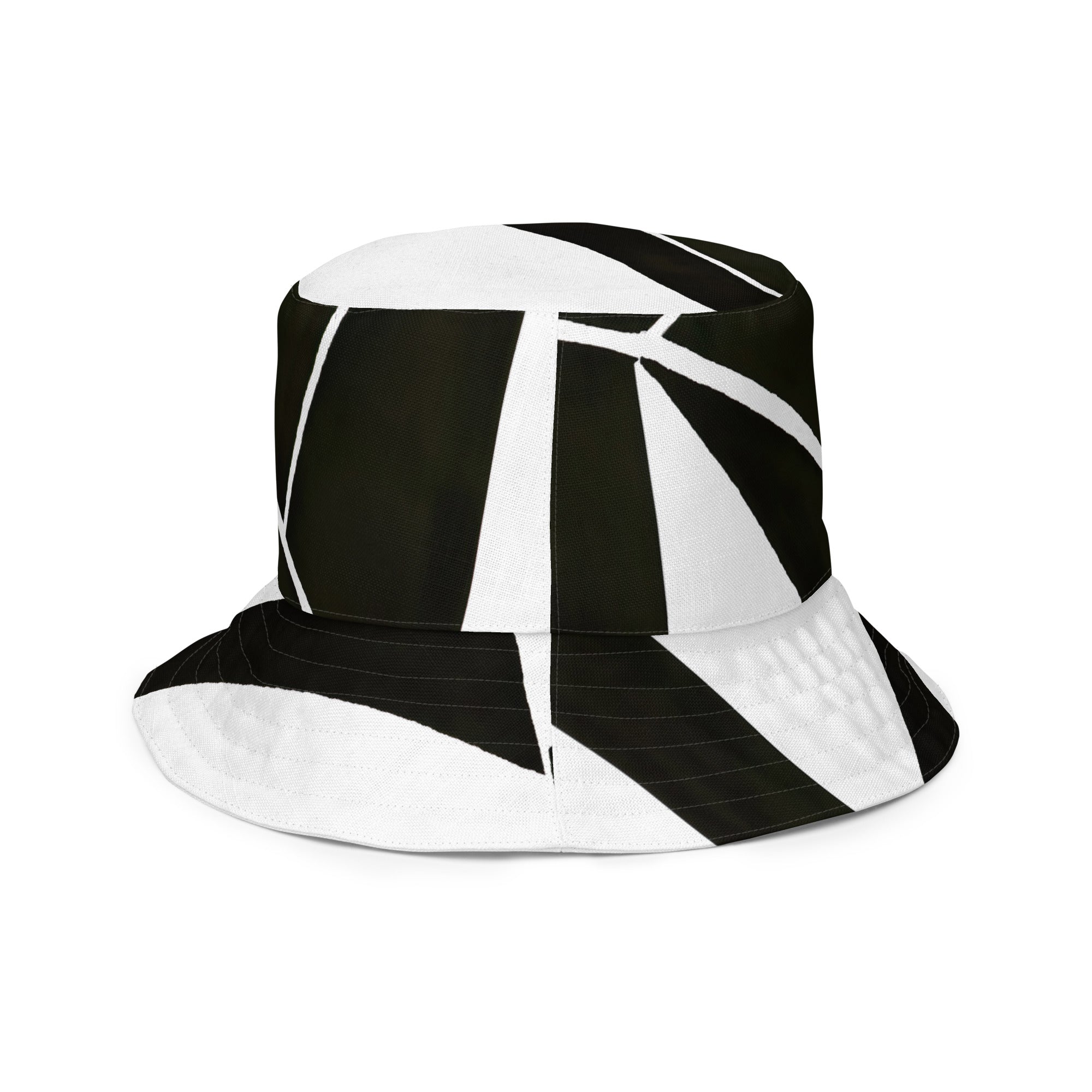 Reversible bucket hat featuring a black and white geometric pattern, showcasing its stylish design and breathable fabric.