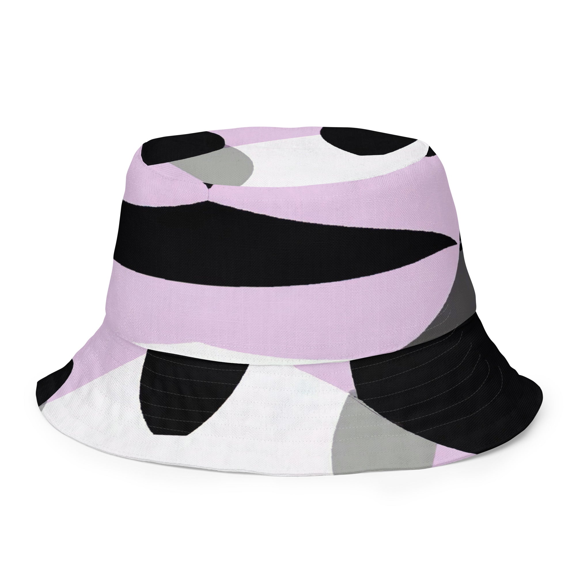 Reversible bucket hat featuring a geometric lavender and black pattern, showcasing both sides of the design.