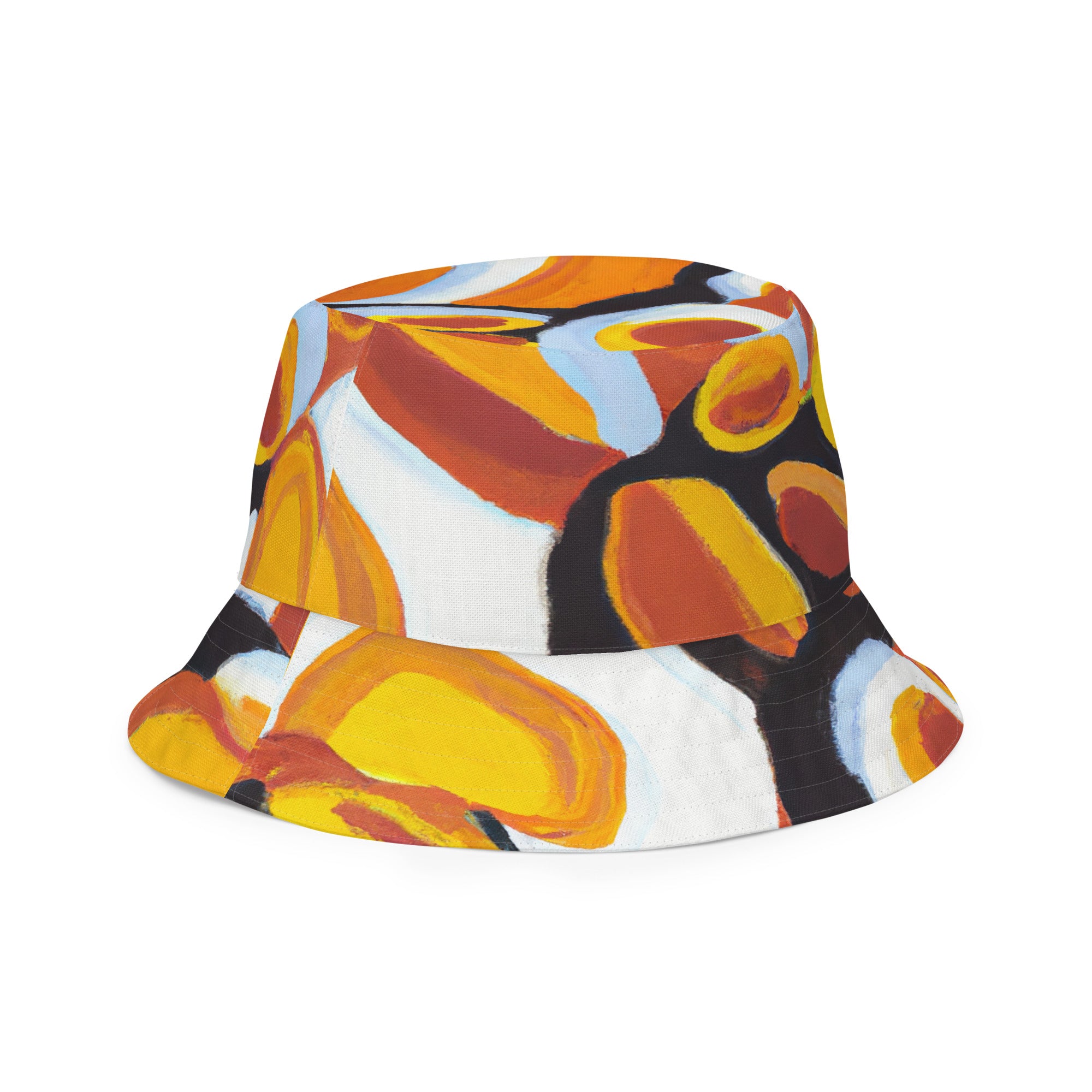 Reversible bucket hat featuring an orange, black, and white geometric print pattern, showcasing its stylish design and premium fabric.