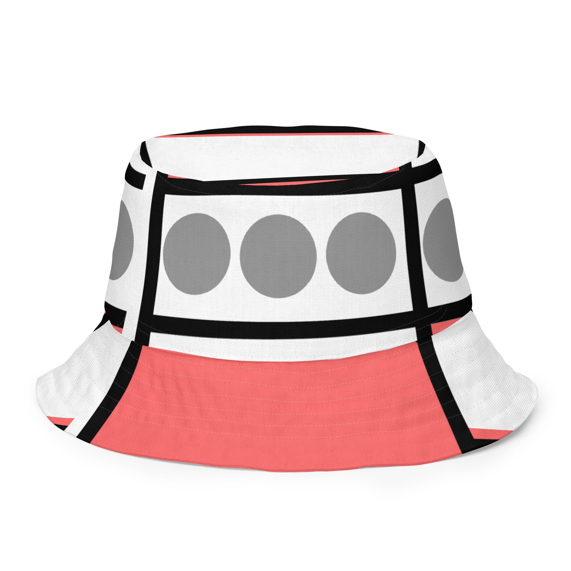 Reversible bucket hat in pale red print with geometric pattern, showcasing its stylish design and breathable fabric.