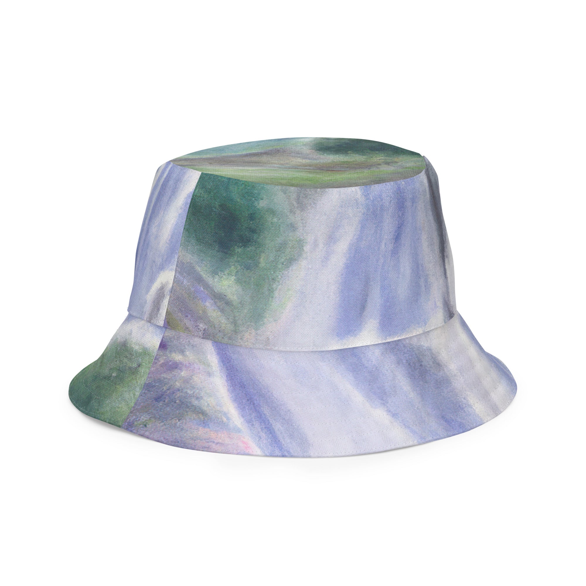 Reversible bucket hat featuring a purple watercolor waterfall and green landscape print, showcasing its stylish design and breathable fabric.
