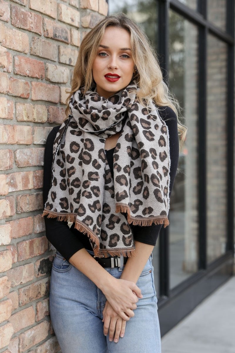 Reversible Leopard Blanket Scarf showcasing bold leopard print and complementary design, perfect for stylish layering.