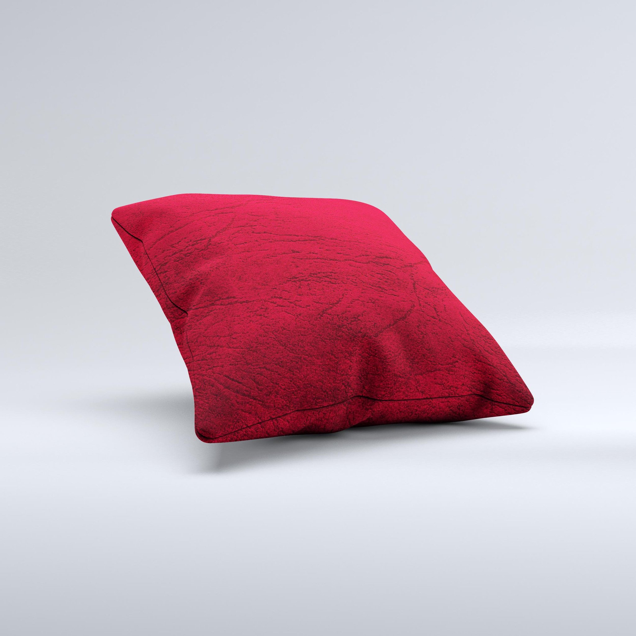 Rich red leather decorative throw pillow with unique ink-fuzed design, handcrafted in Virginia, showcasing luxurious texture and vibrant color.