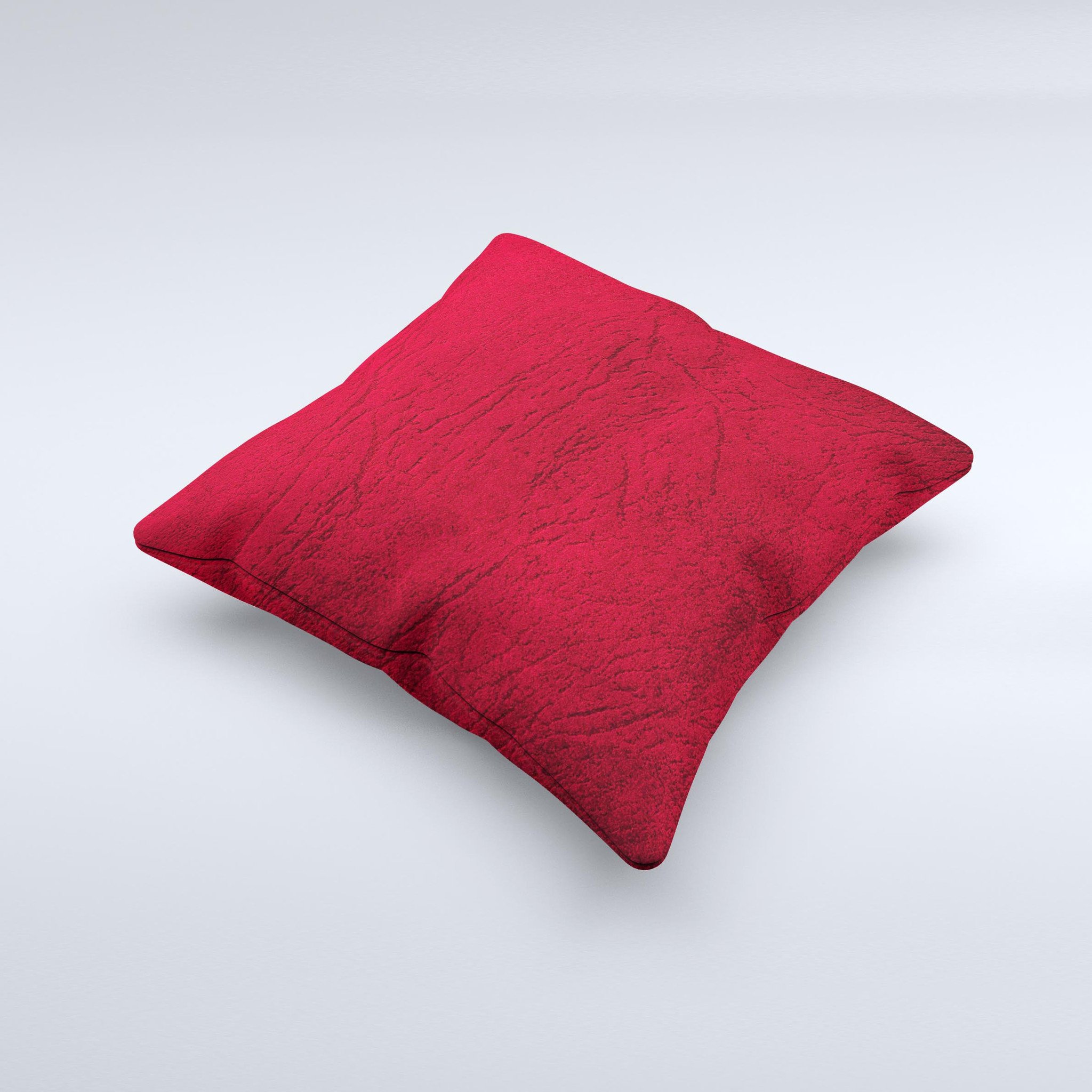 Rich red leather decorative throw pillow with unique ink-fuzed design, handcrafted in Virginia, showcasing luxurious texture and vibrant color.