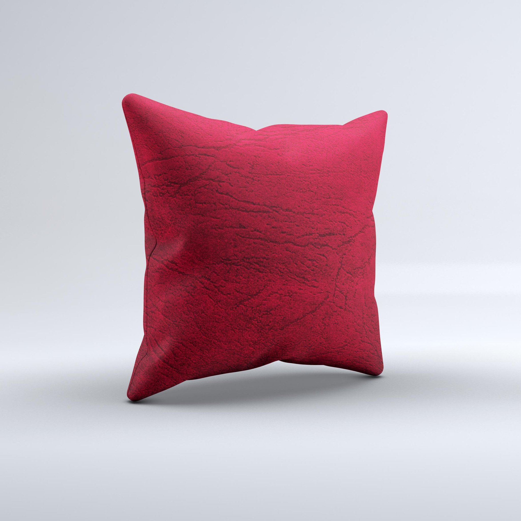 Rich red leather decorative throw pillow with unique ink-fuzed design, handcrafted in Virginia, showcasing luxurious texture and vibrant color.
