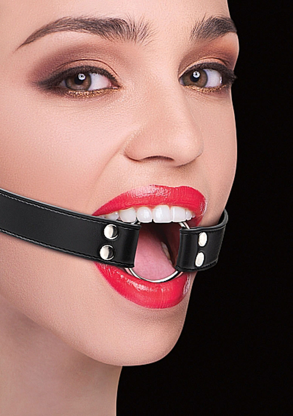 Woman wearing mouth gag.