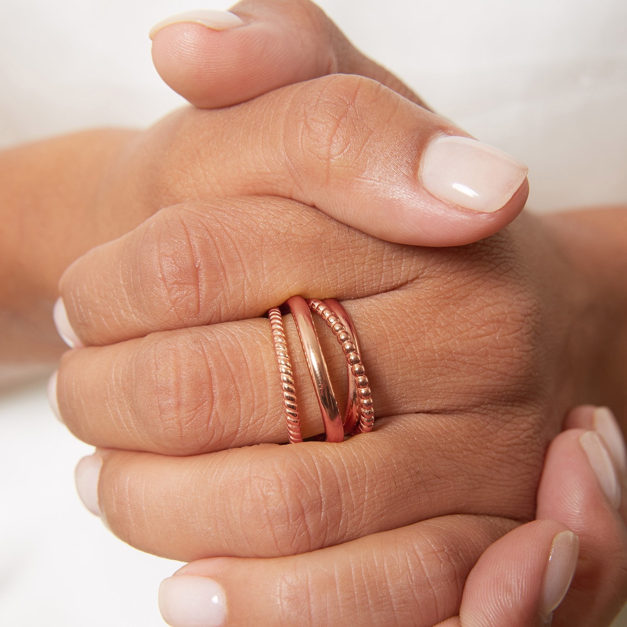 Rose Gold Plated 925 Sterling Silver Cable-Style Crossover Ring showcasing its elegant design and shiny finish.