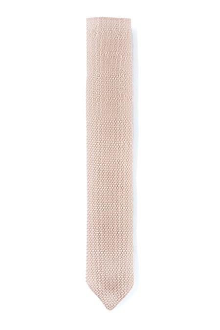 A stylish rose quartz knitted tie with a pointed end, showcasing its elegant texture and modern design.