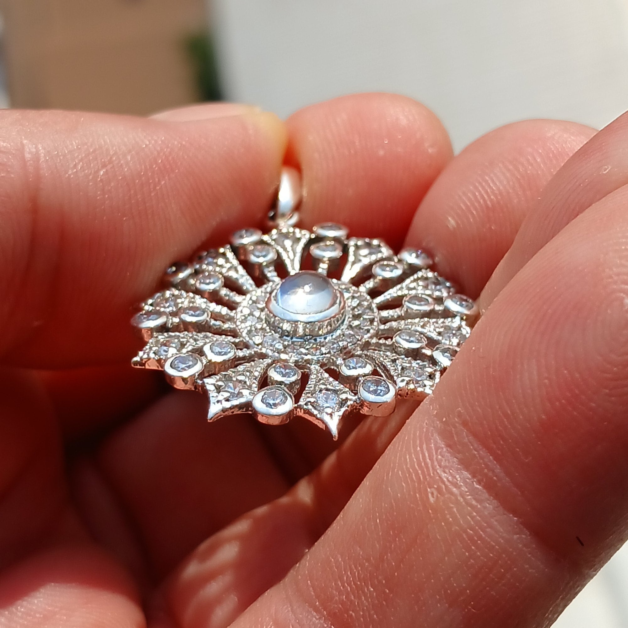 Round Moonstone Amulet pendant in sterling silver with cubic zirconia stones, showcasing a 6mm Ceylon moonstone.