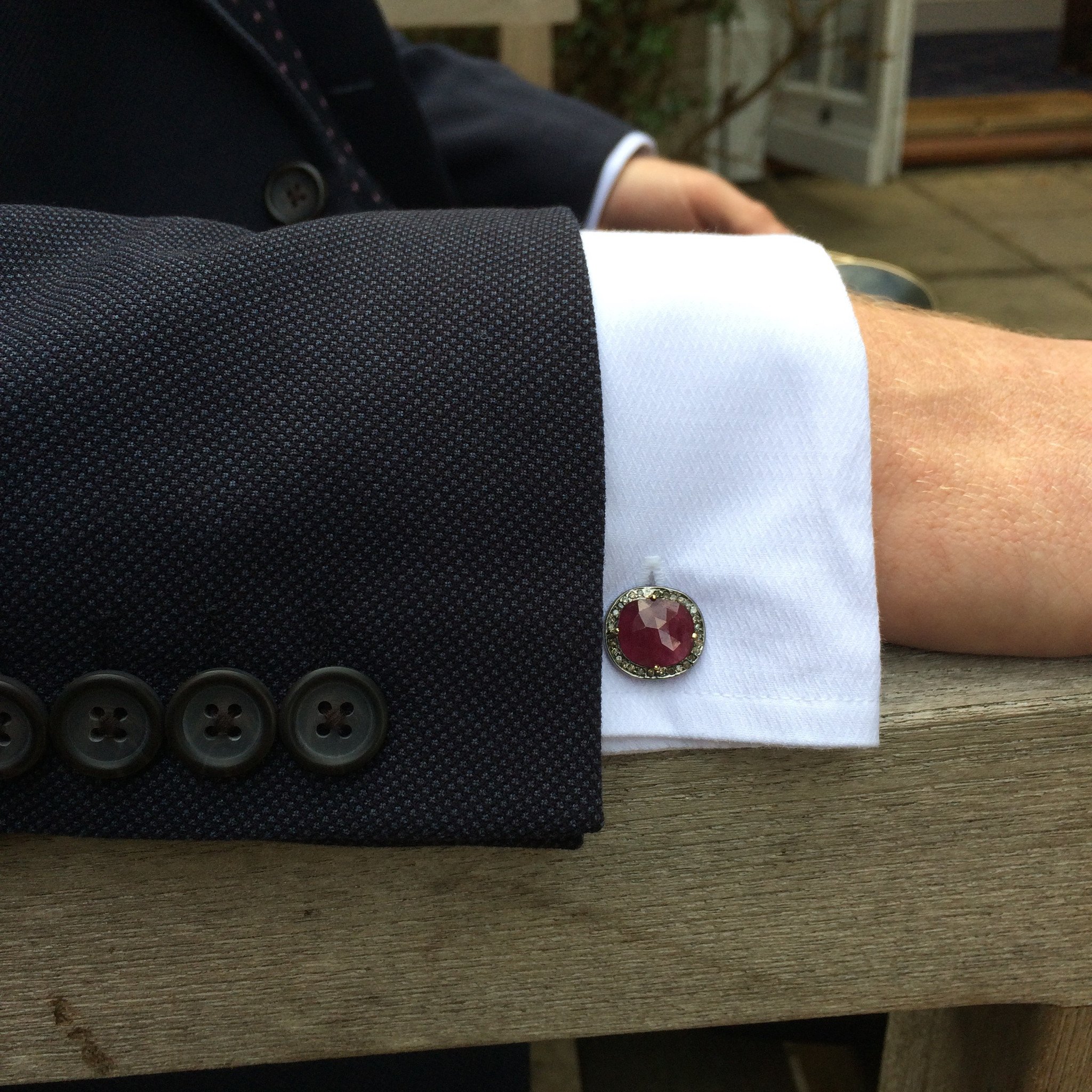 Elegant ruby cufflinks in oxidised silver with champagne diamonds, showcasing a unique organic design.