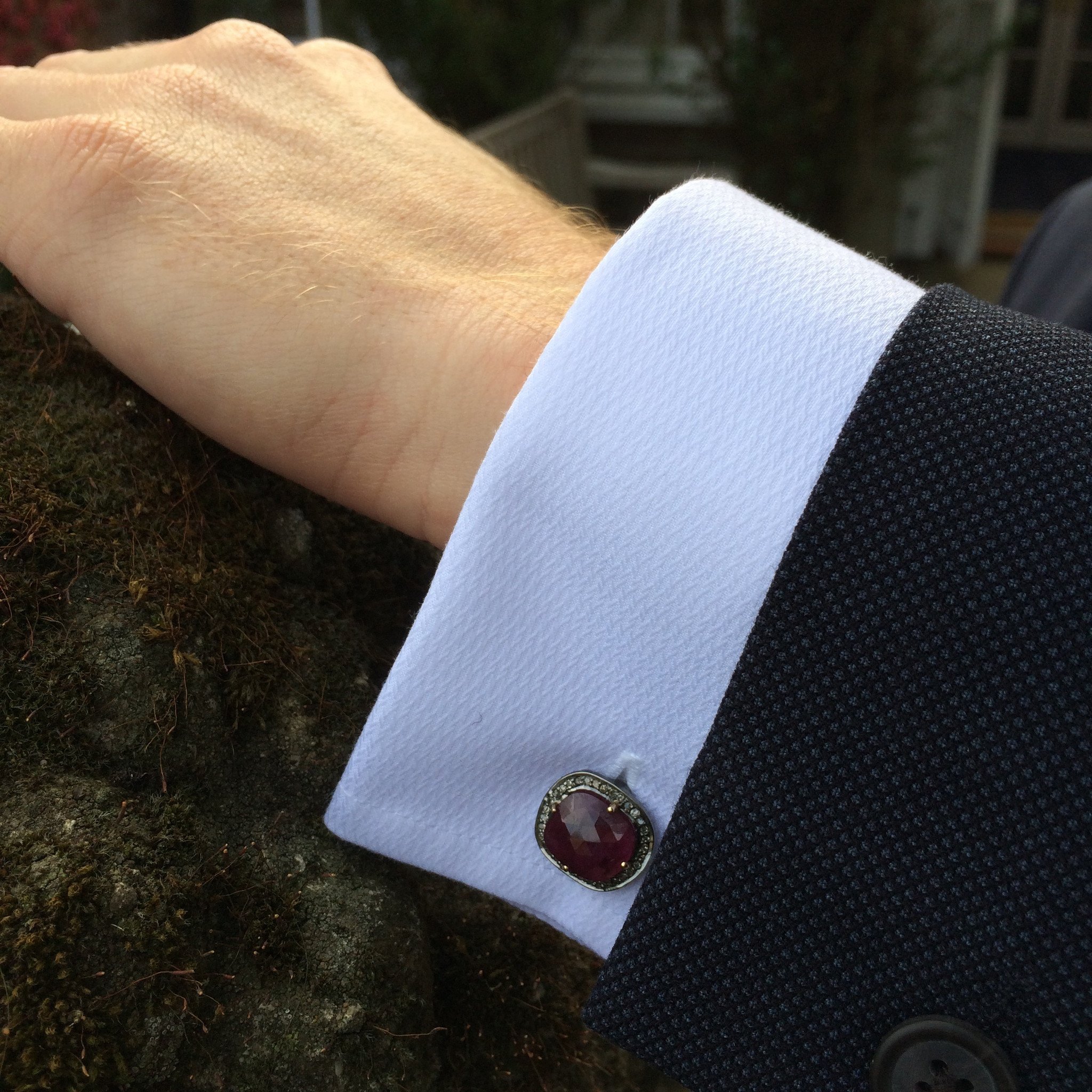 Elegant ruby cufflinks in oxidised silver with champagne diamonds, showcasing a unique organic design.