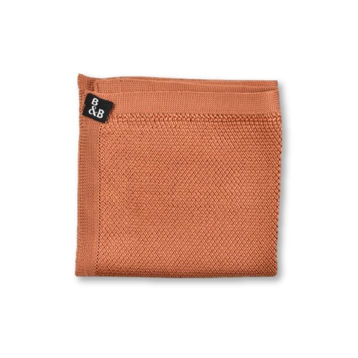 Rustic orange knitted pocket square with a textured finish, measuring 23cm x 23cm, perfect for formal and casual wear.