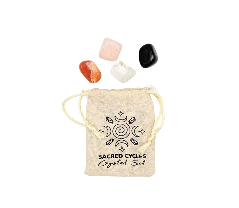 Sacred Cycles Crystal Set featuring obsidian, clear quartz, carnelian, and rose quartz in a muslin bag, ideal for spiritual rituals.