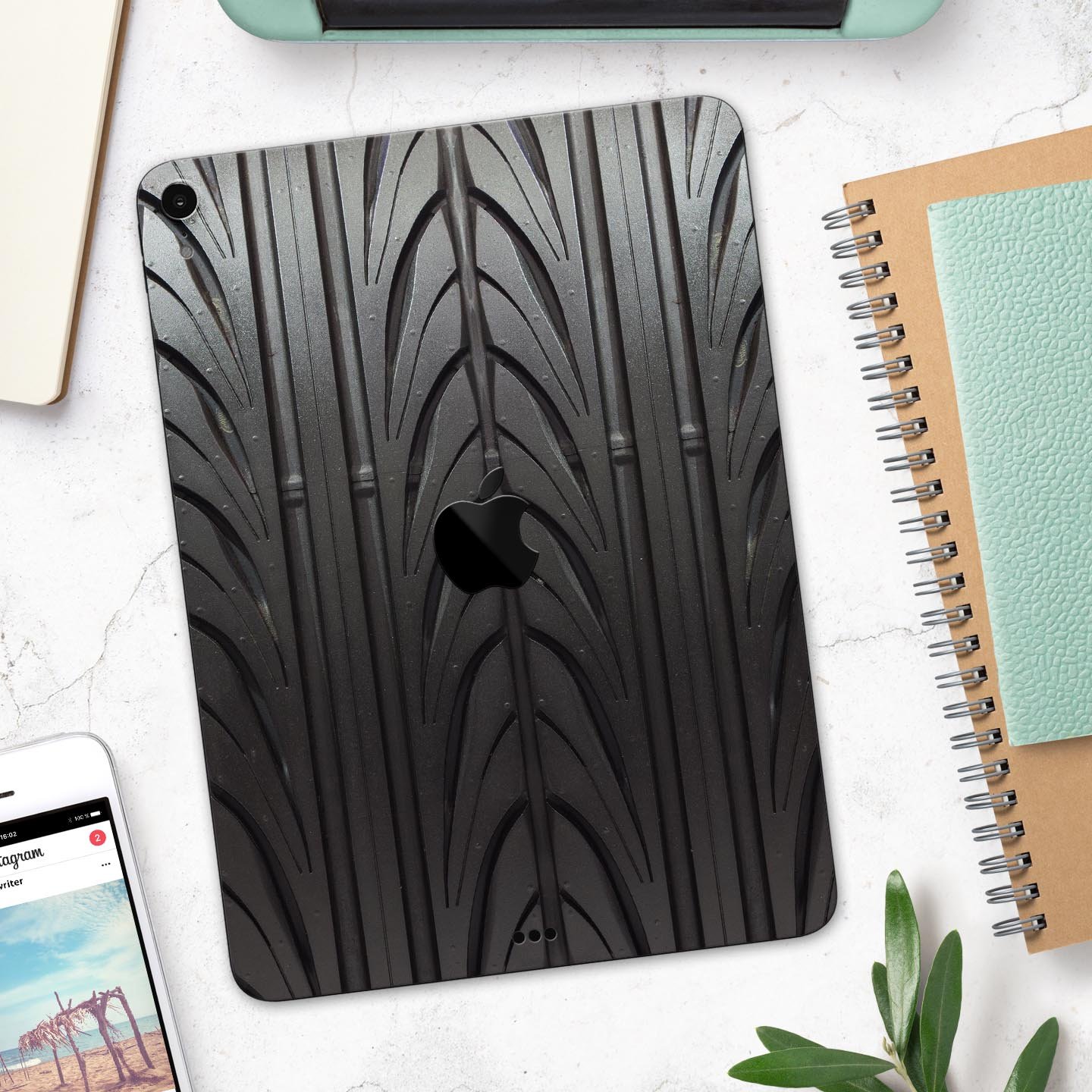 Shiny Black Tire Tread Full Body Skin Decal for Apple iPad Pro, showcasing a sleek design and premium finish.