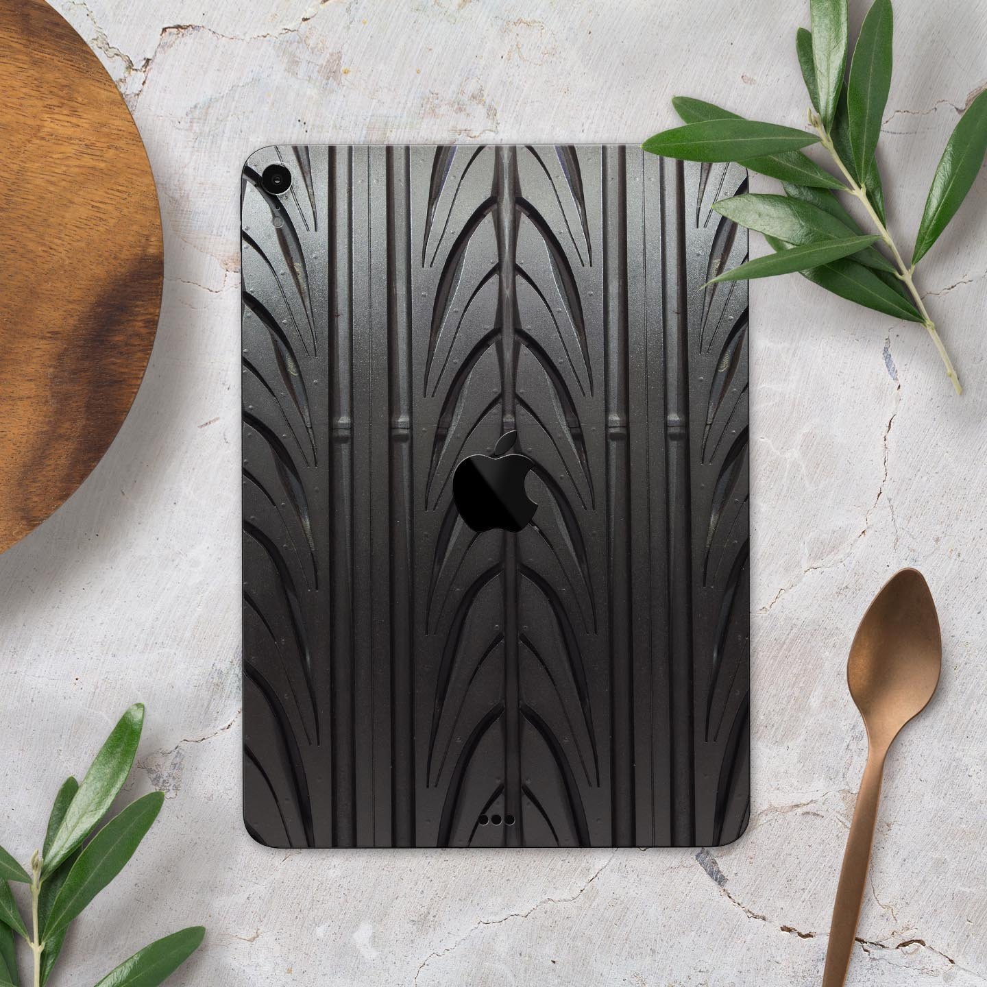 Shiny Black Tire Tread Full Body Skin Decal for Apple iPad Pro, showcasing a sleek design and premium finish.