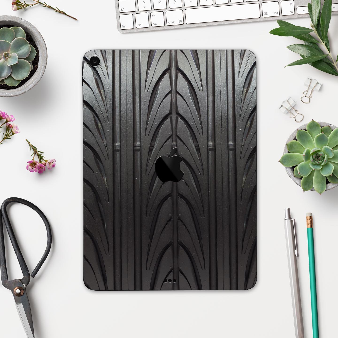 Shiny Black Tire Tread Full Body Skin Decal for Apple iPad Pro, showcasing a sleek design and premium finish.