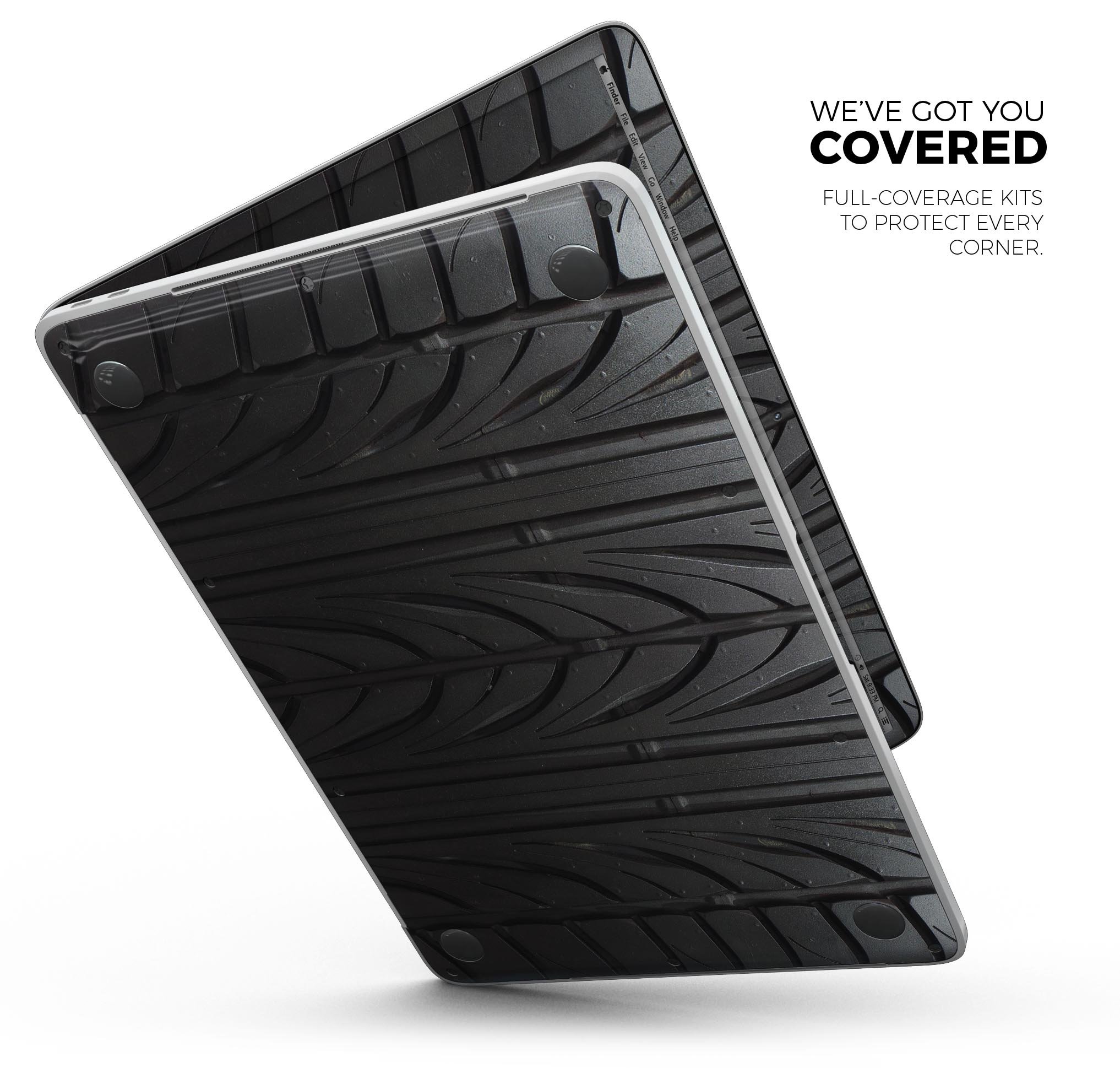 Laptop with tire-patterned protective cover.
