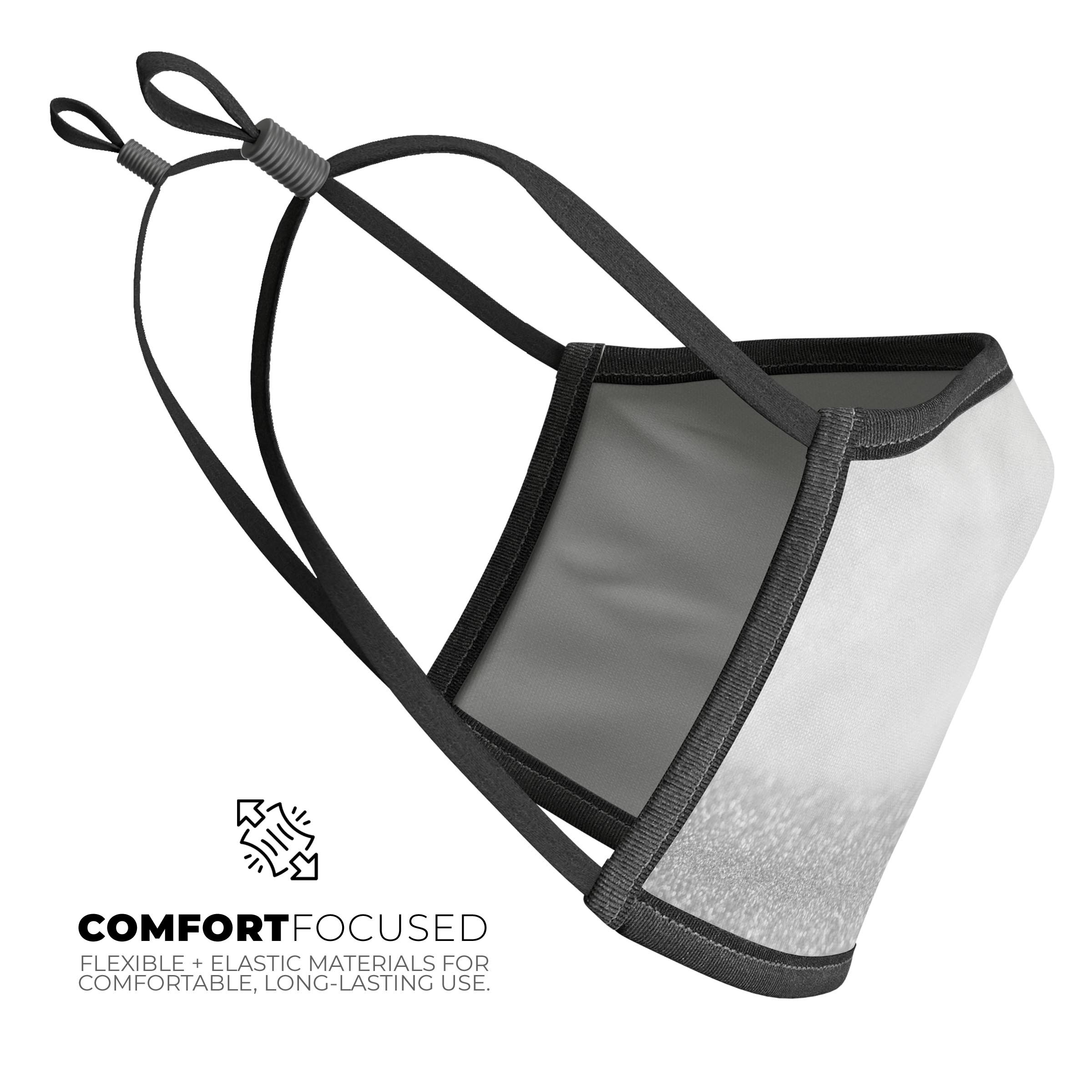 Silver and White Unfocused Sparkle Orbs mouth cover, showcasing a stylish design with adjustable ear loops.