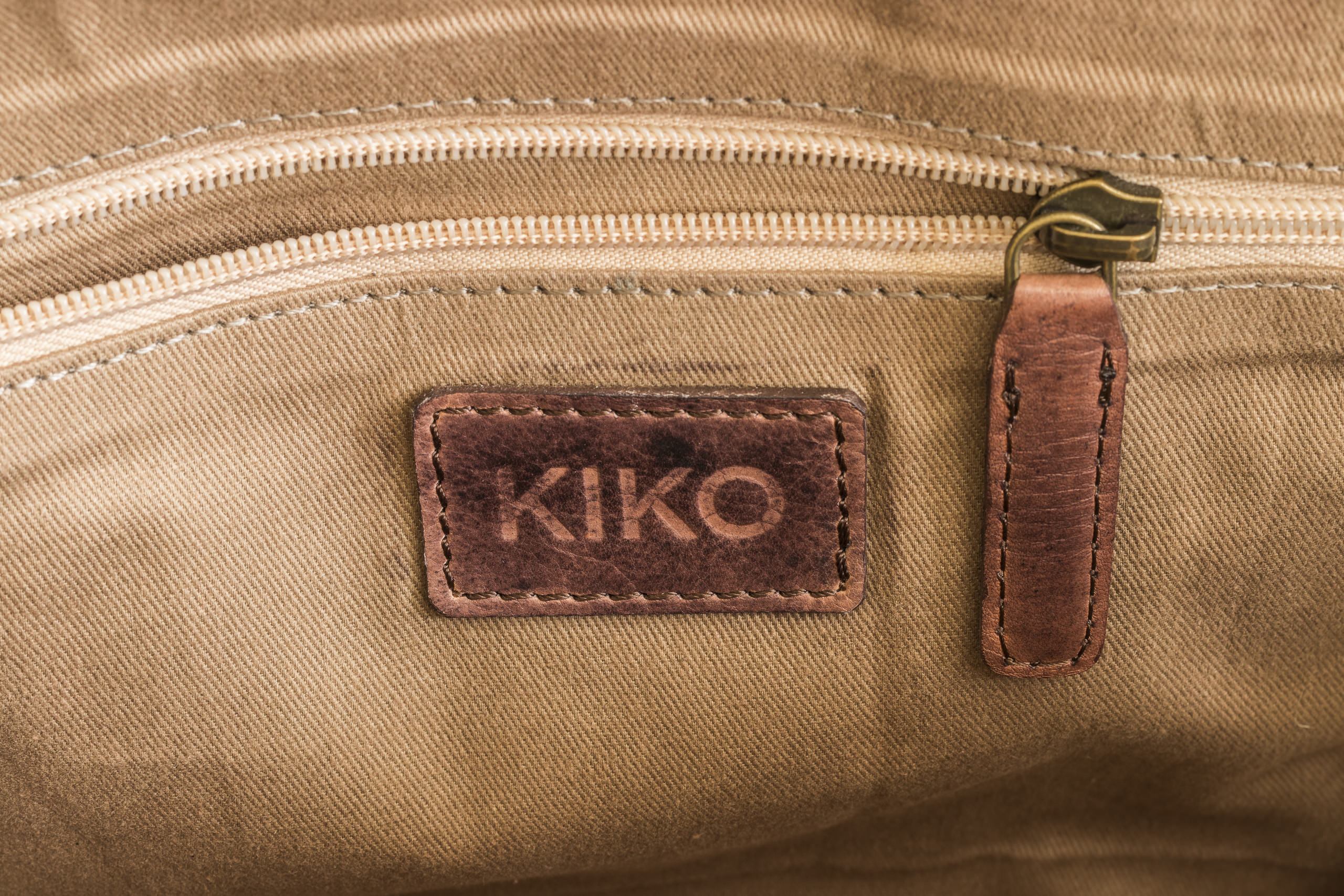 A stylish Sleek Brief made of genuine washed leather, featuring an adjustable shoulder strap and multiple pockets for organization.