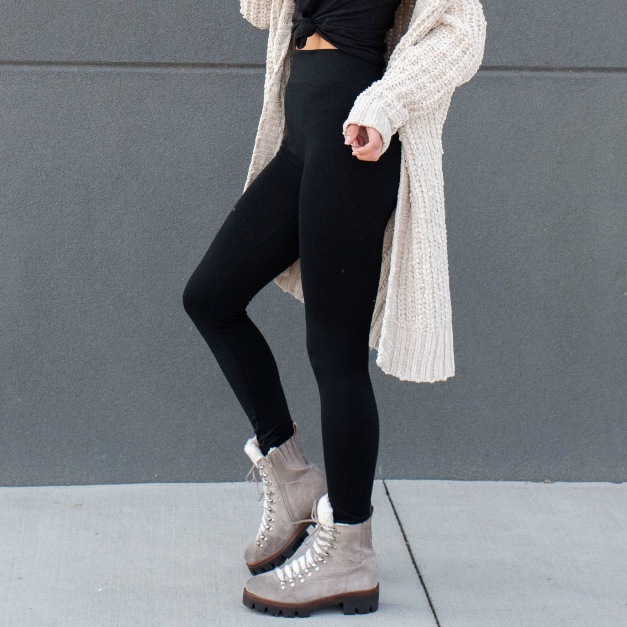 Slimming High Waist Leggings in black, featuring a tall waistband and interlock seams for comfort and support.